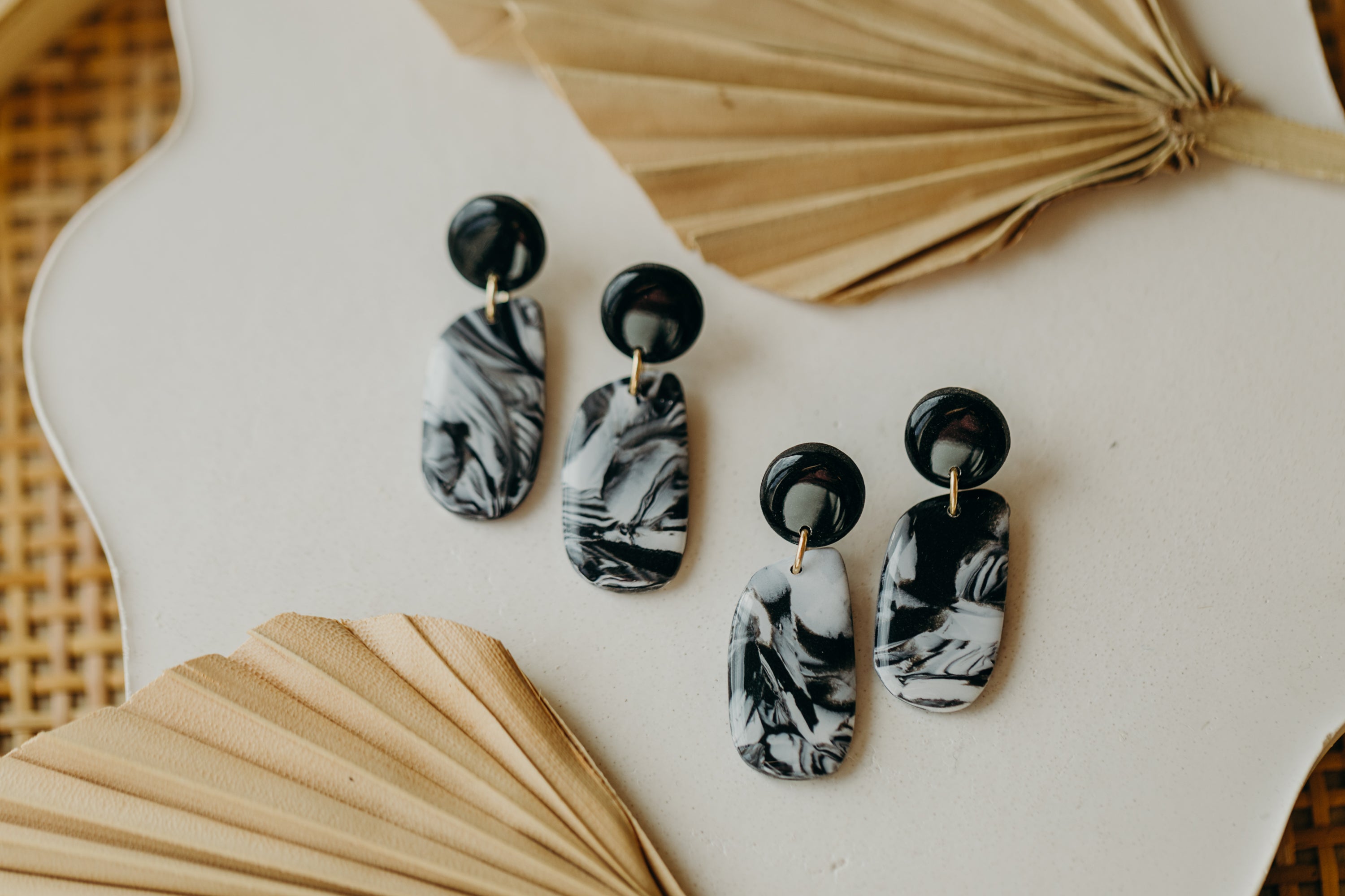 black polymer clay earrings with white pattern