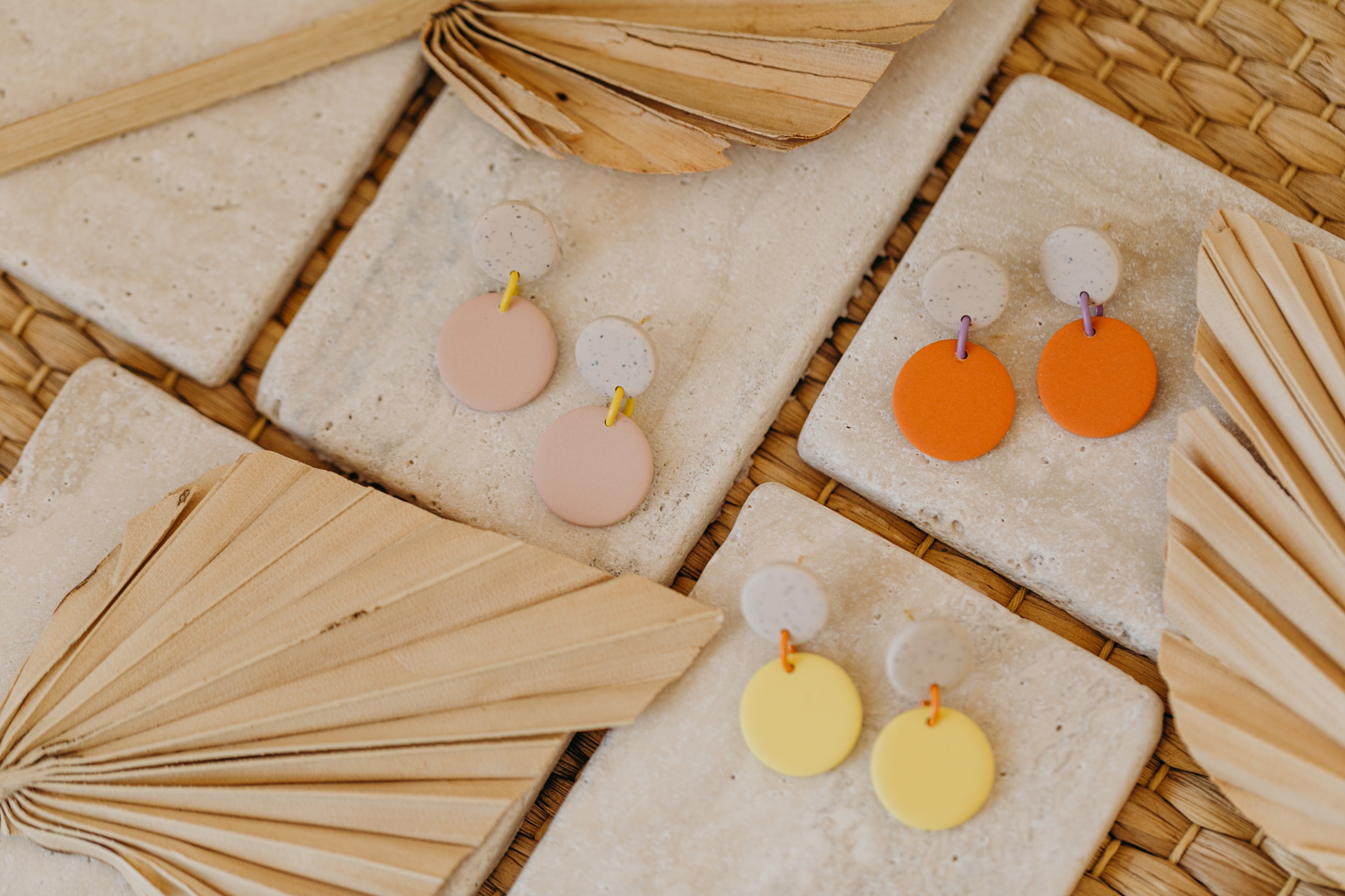 two-tone round polymer clay earrings in bright colors