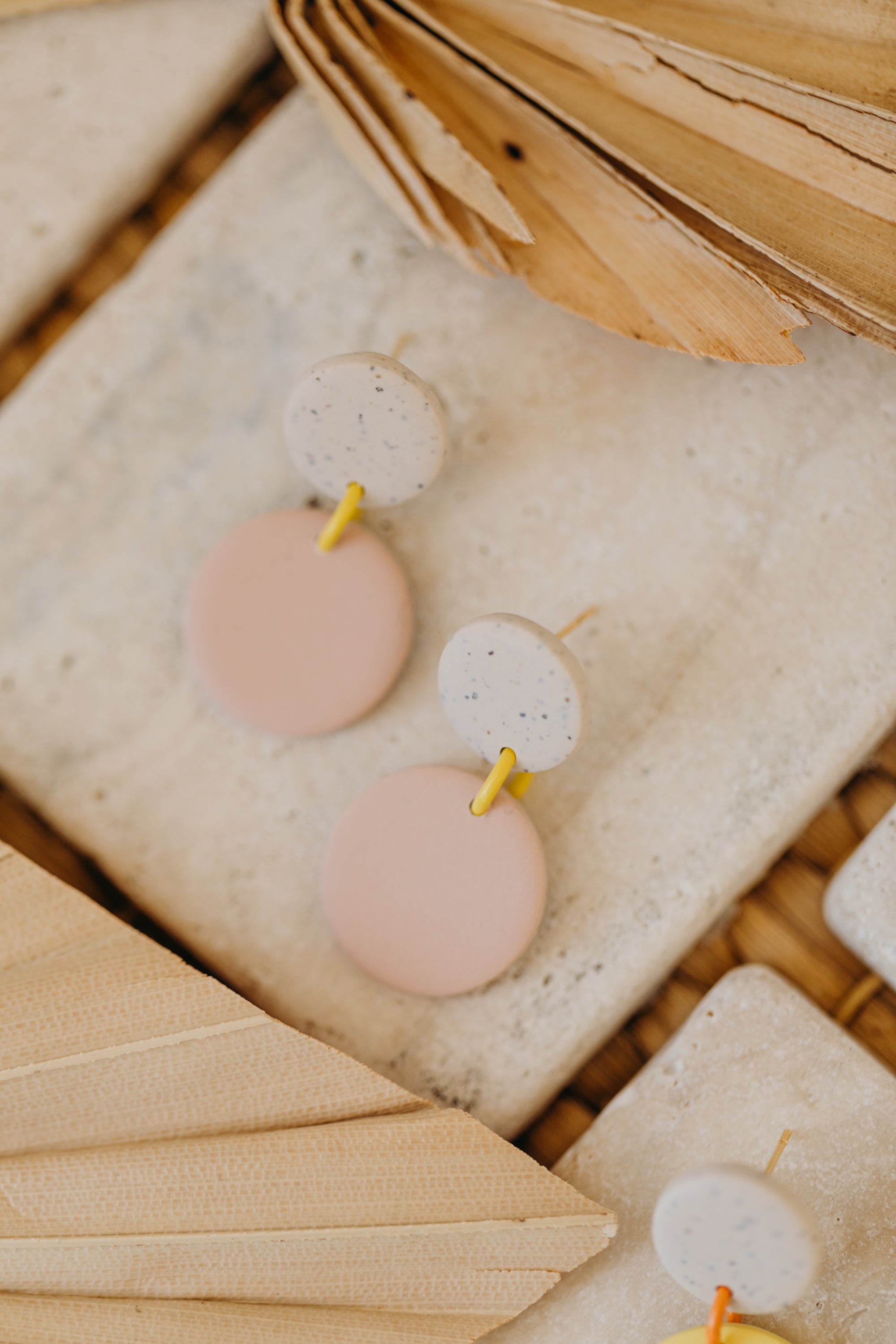 two-tone round polymer clay earrings in bright colors