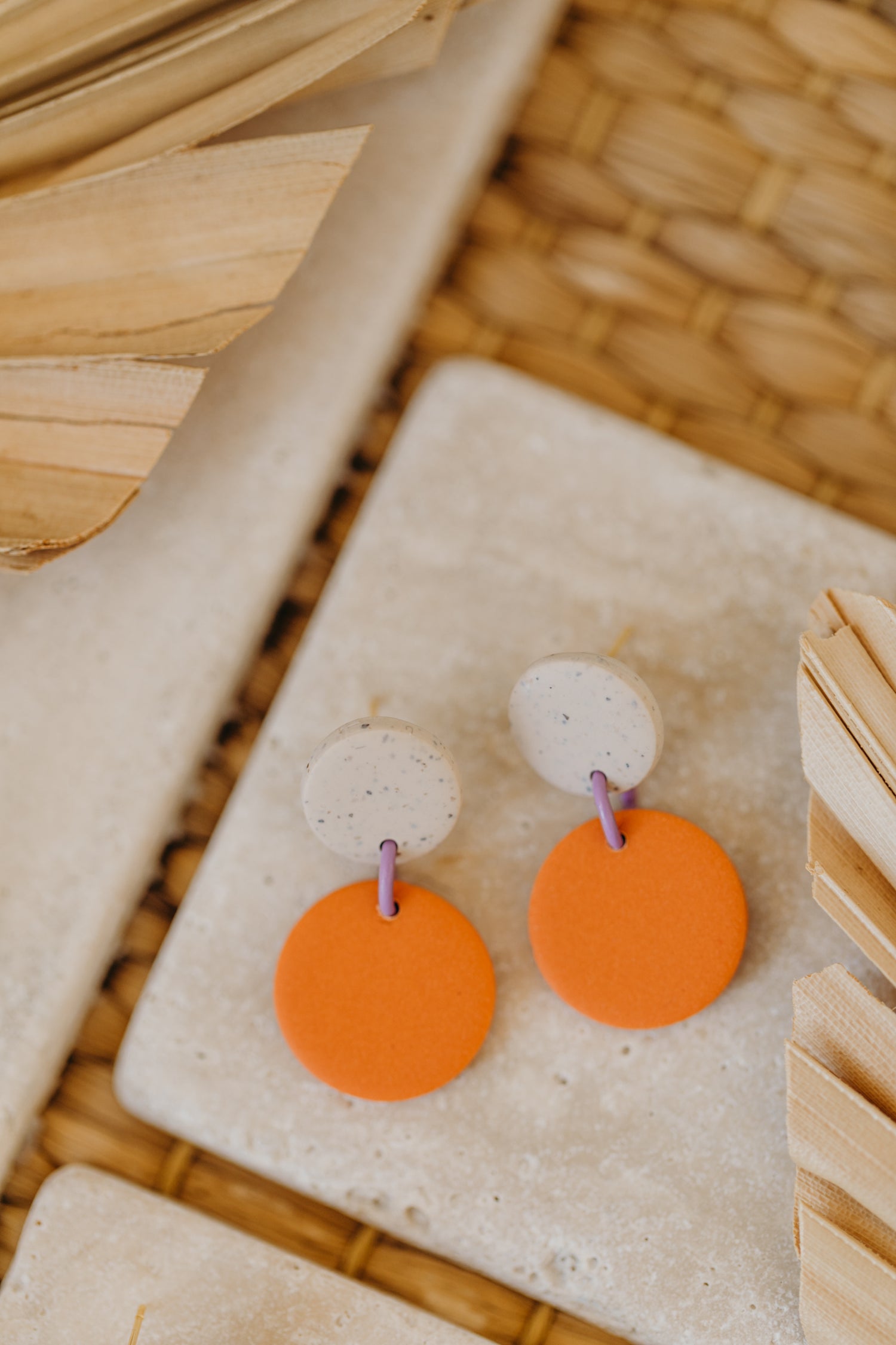 two-tone round polymer clay earrings in bright colors