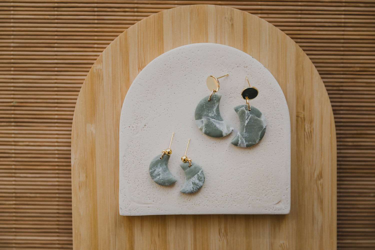 Hoop earrings with round polymer clay pendant and leaf