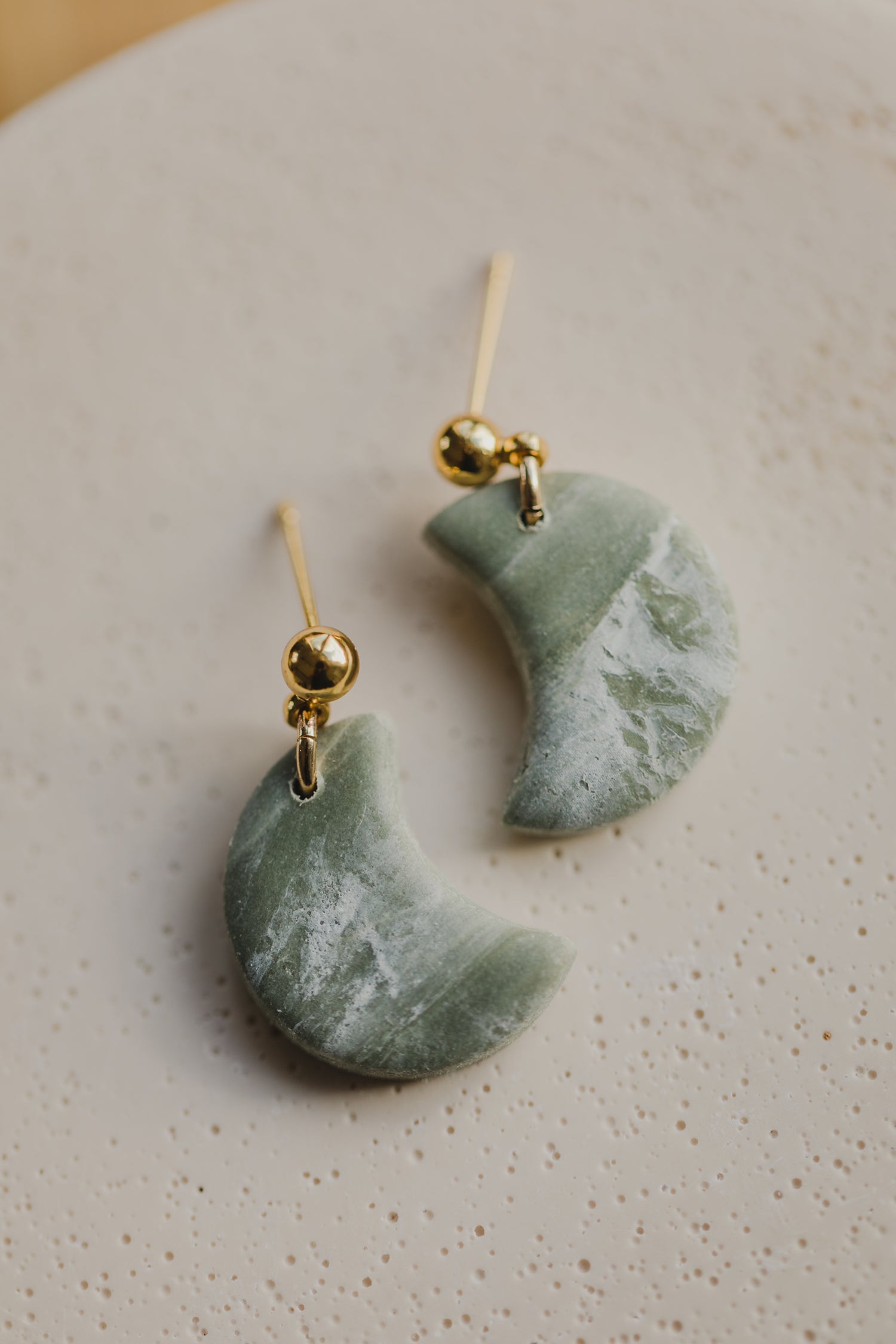 Hoop earrings with round polymer clay pendant and leaf