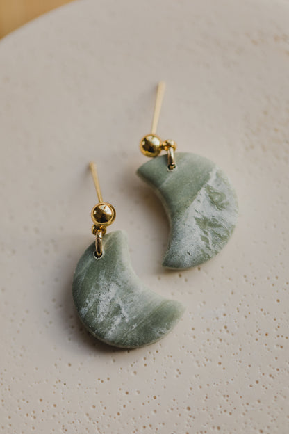 Hoop earrings with round polymer clay pendant and leaf