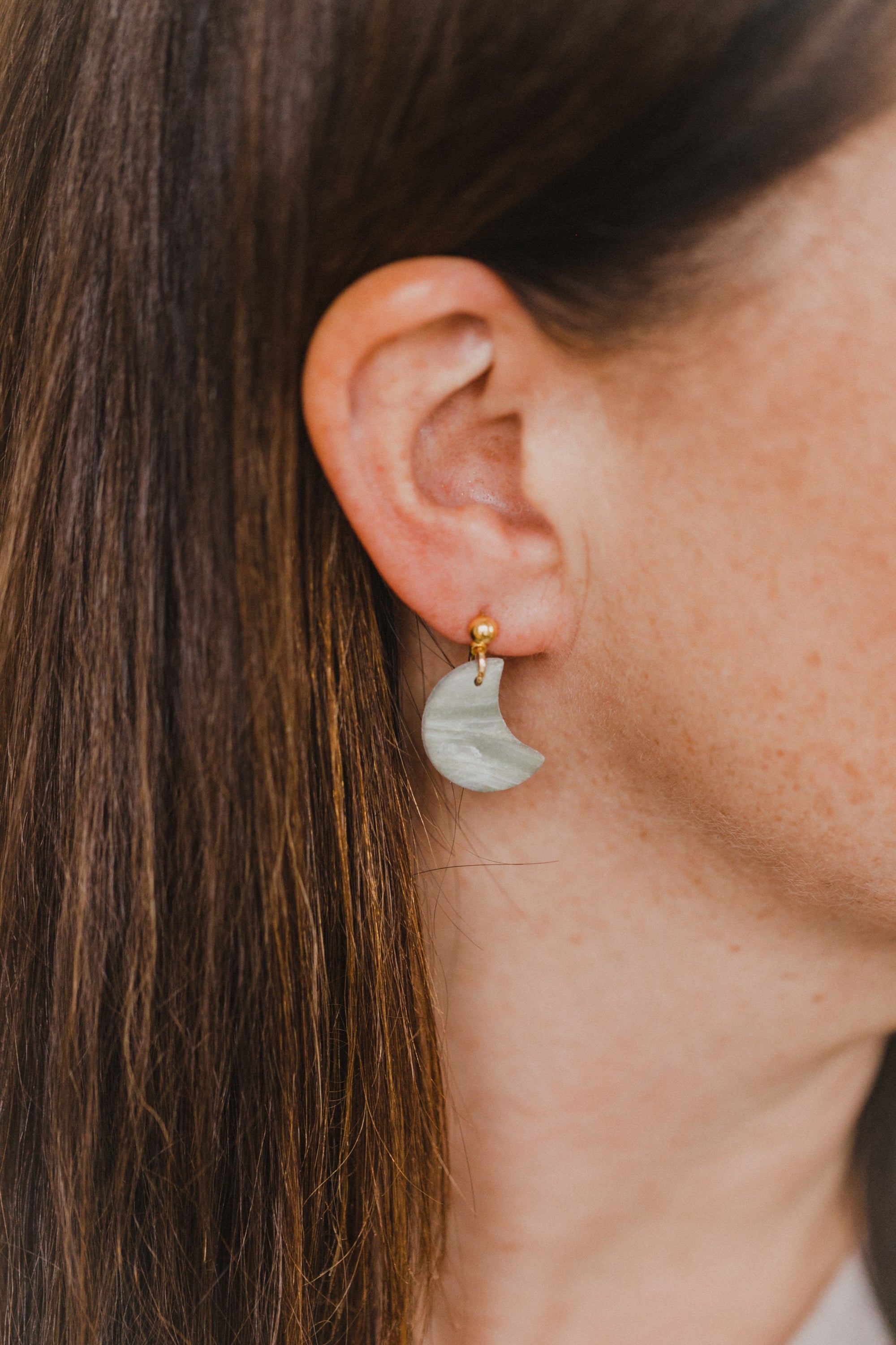 Hoop earrings with round polymer clay pendant and leaf