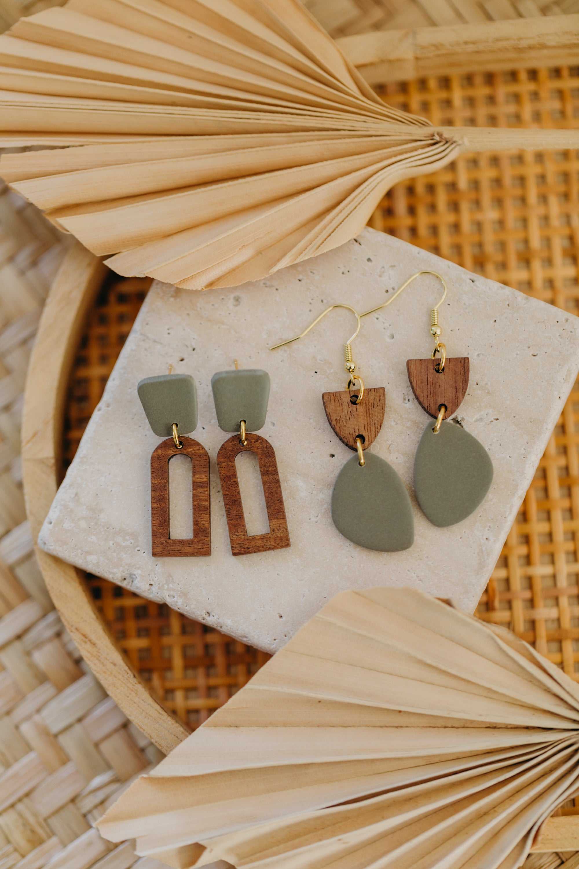 triangular polymer clay earrings in eucalyptus green with rectangular wooden pendant