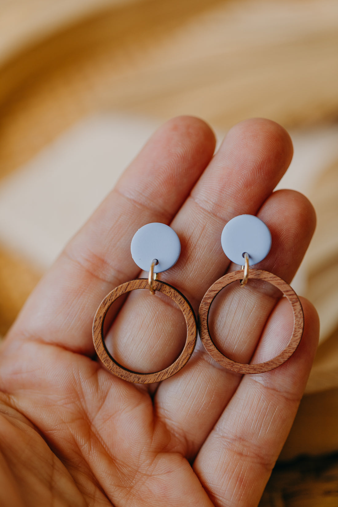 round polymer clay earrings in pastel blue with wooden pendant circle