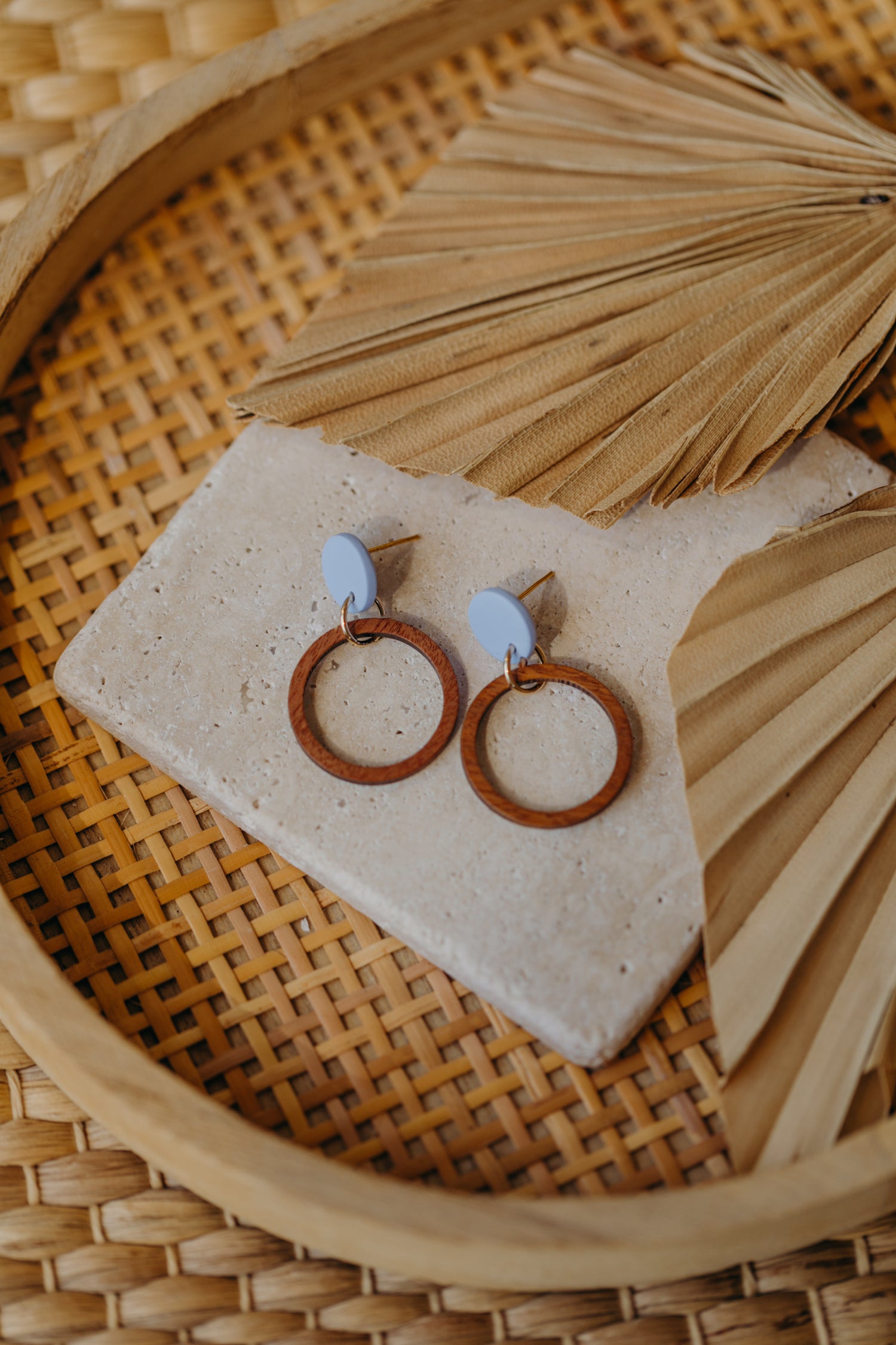 round polymer clay earrings in pastel blue with wooden pendant circle