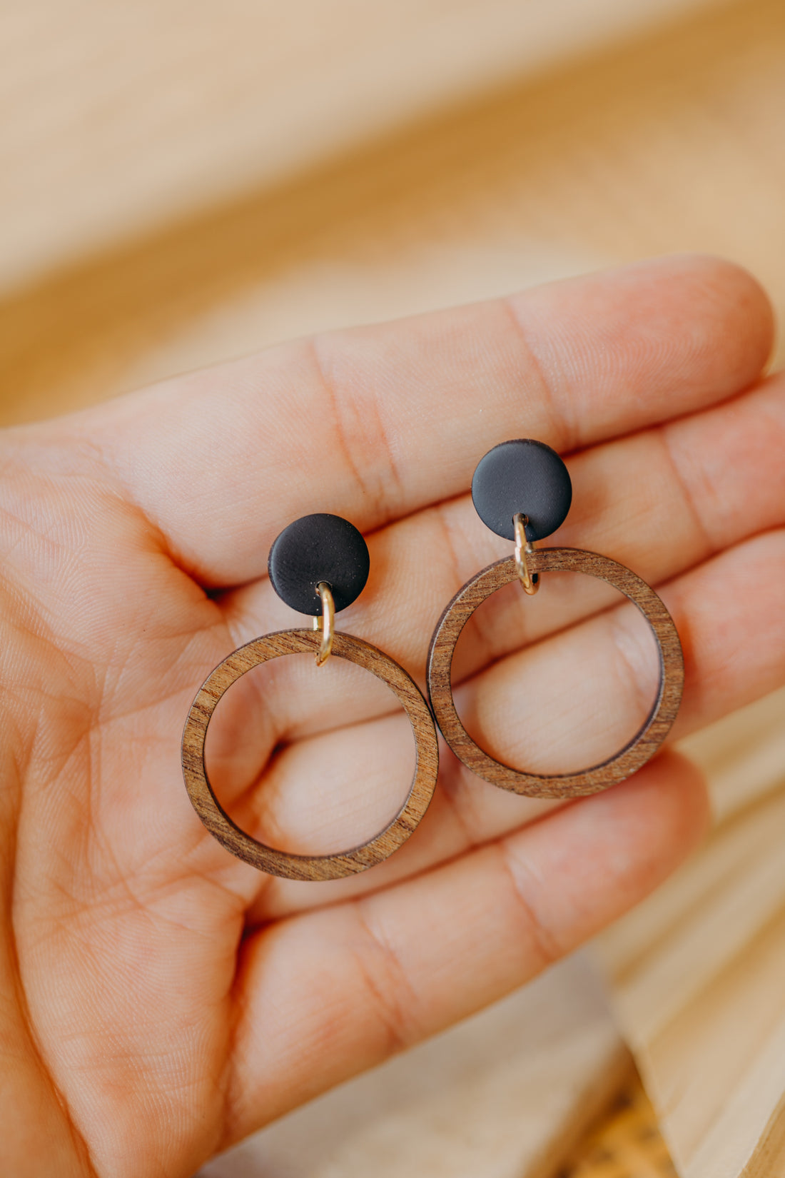 round polymer clay earrings in black with wooden pendant circle