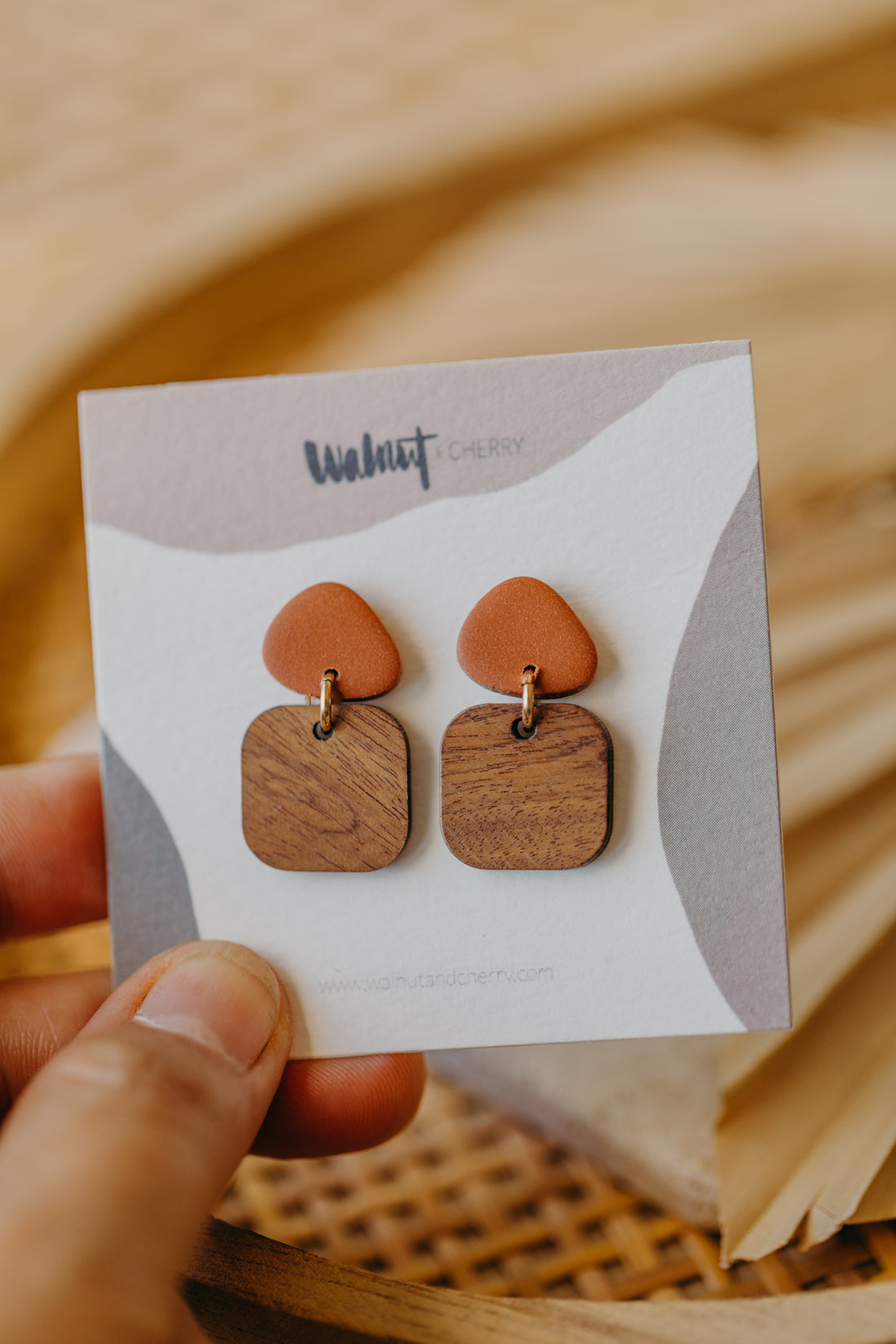 triangular polymer clay earrings in cinnamon with rectangular wooden pendant