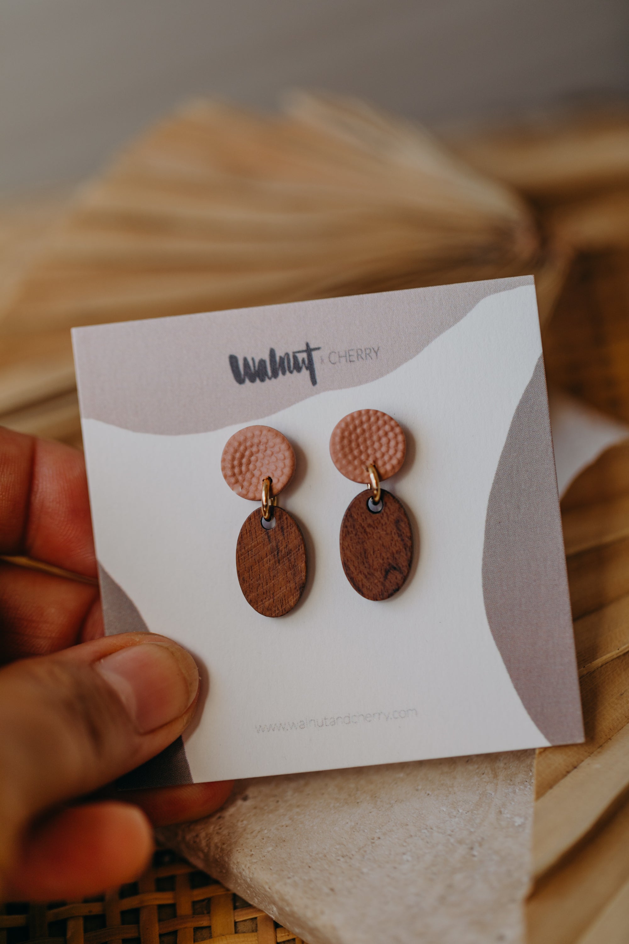 round polymer clay earrings in tangerine with oval wooden pendant