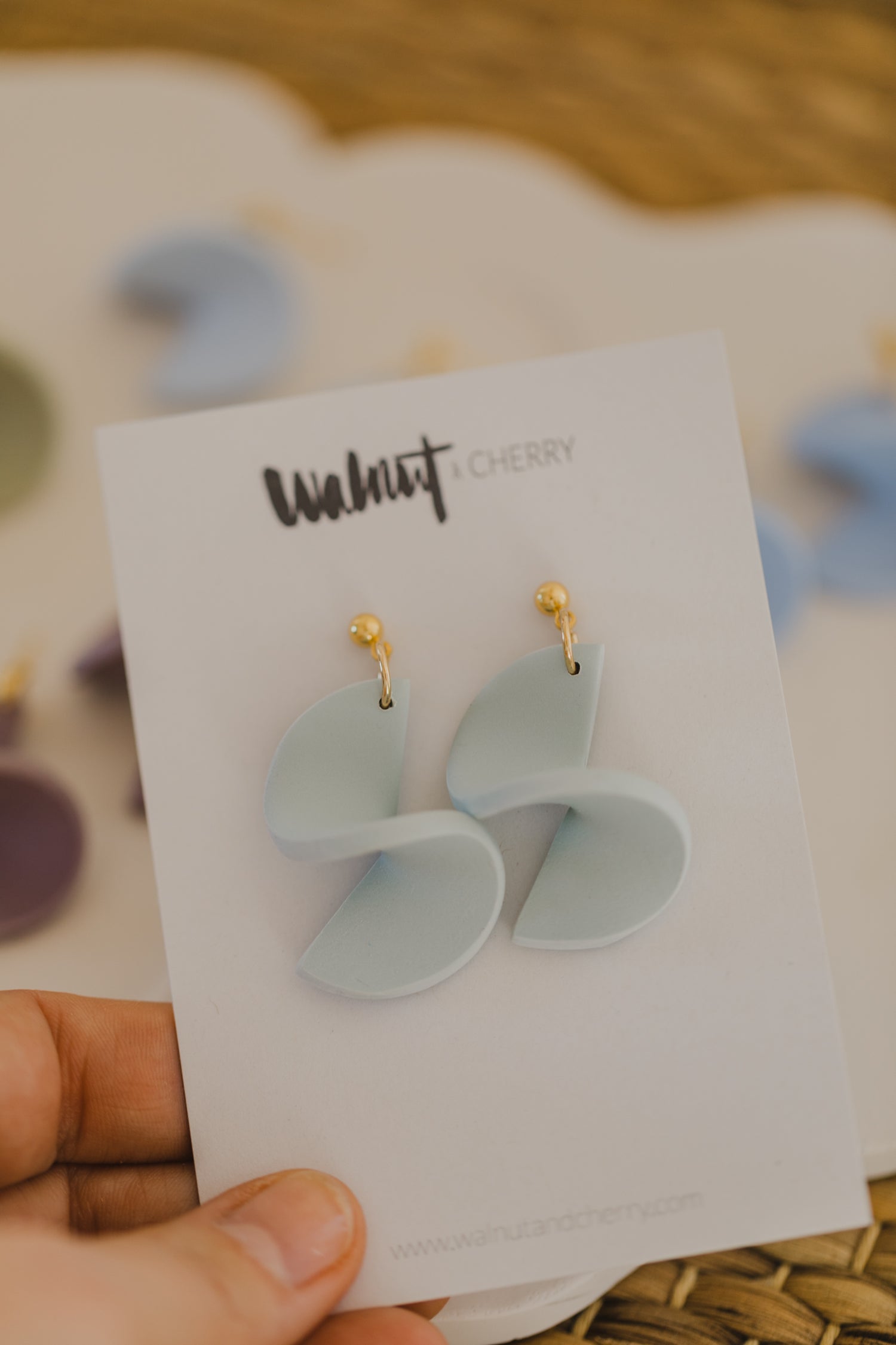 twisted earrings made of polymer clay in pastel colors