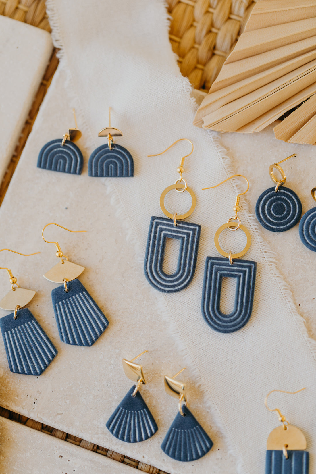 Dark blue polymer clay earrings with white lines