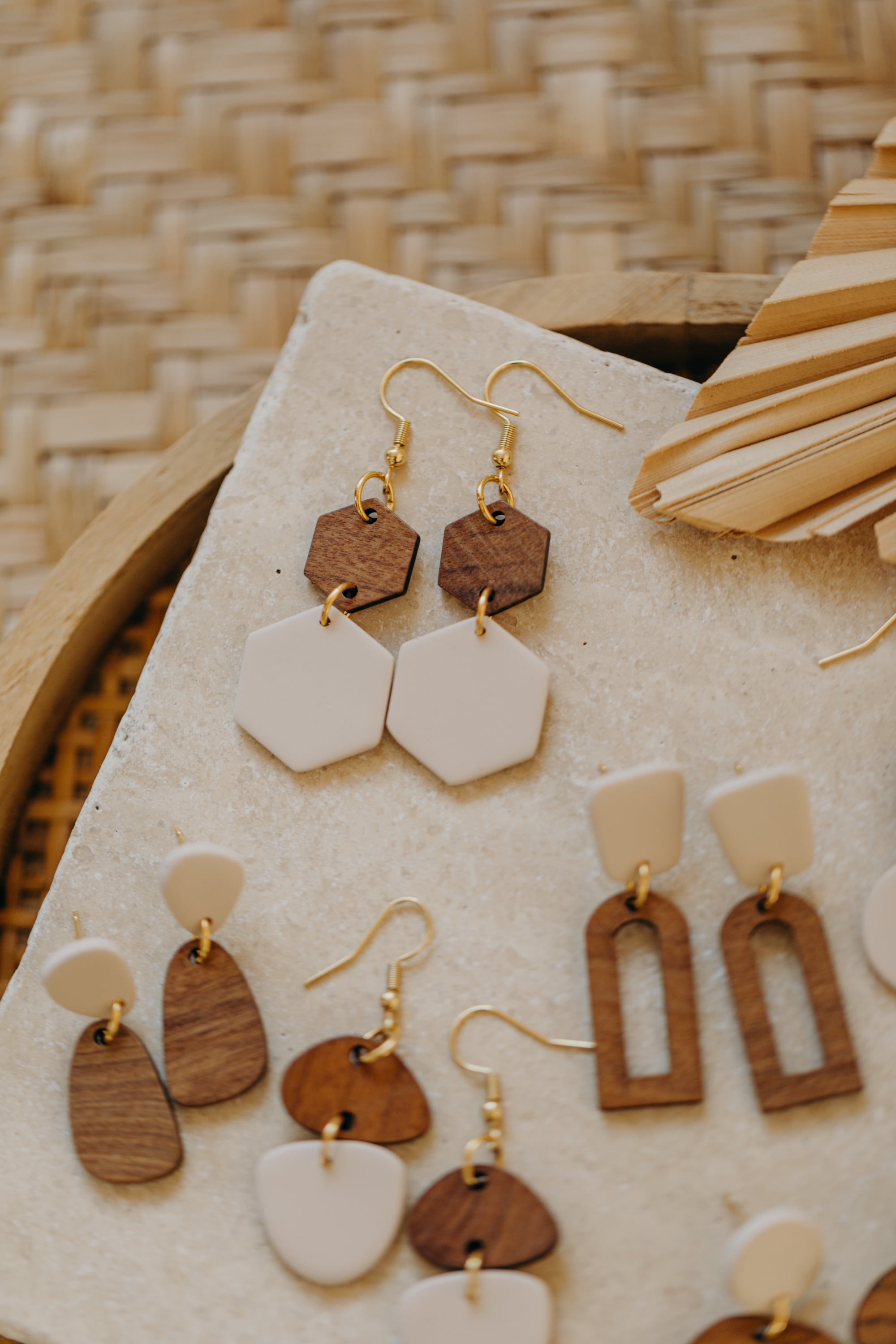 triangular polymer clay earrings in eucalyptus green with rectangular wooden pendant