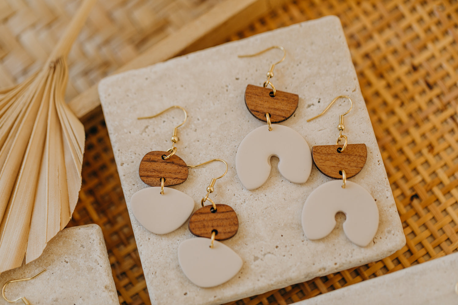 triangular polymer clay earrings in eucalyptus green with rectangular wooden pendant