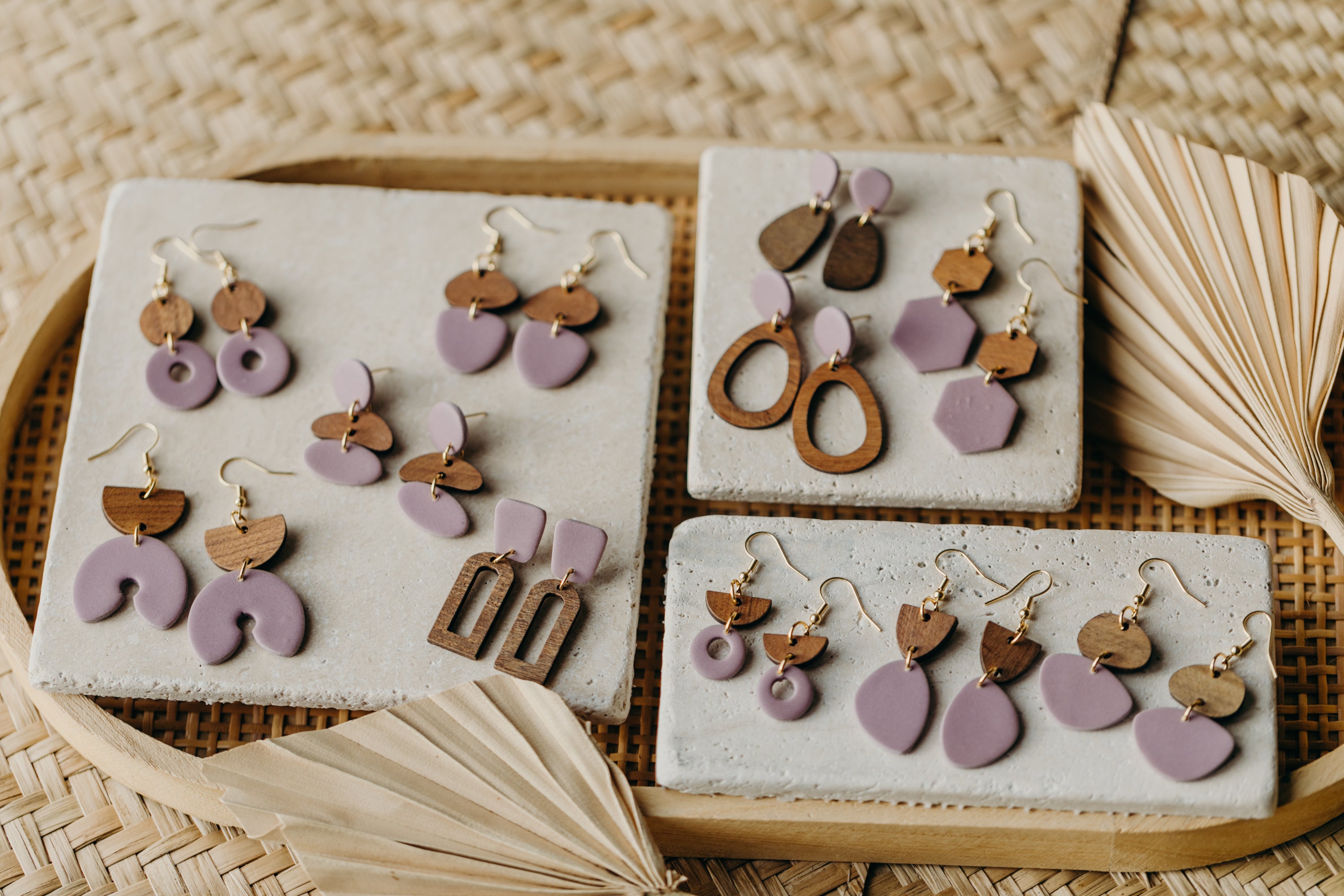 triangular polymer clay earrings in eucalyptus green with rectangular wooden pendant