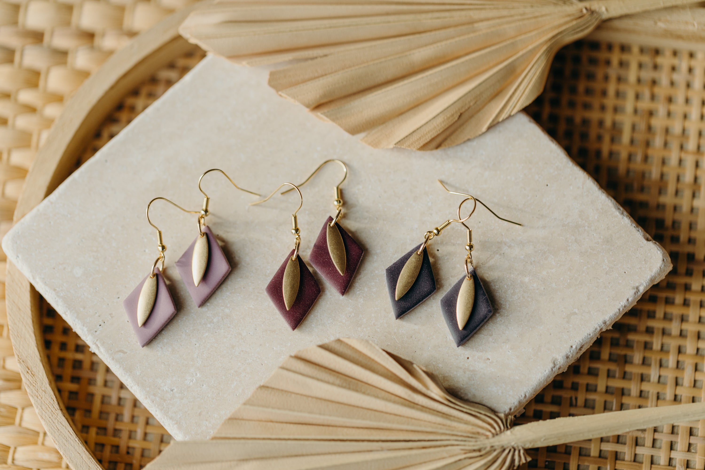 diamond-shaped polymer clay earrings in berry tones