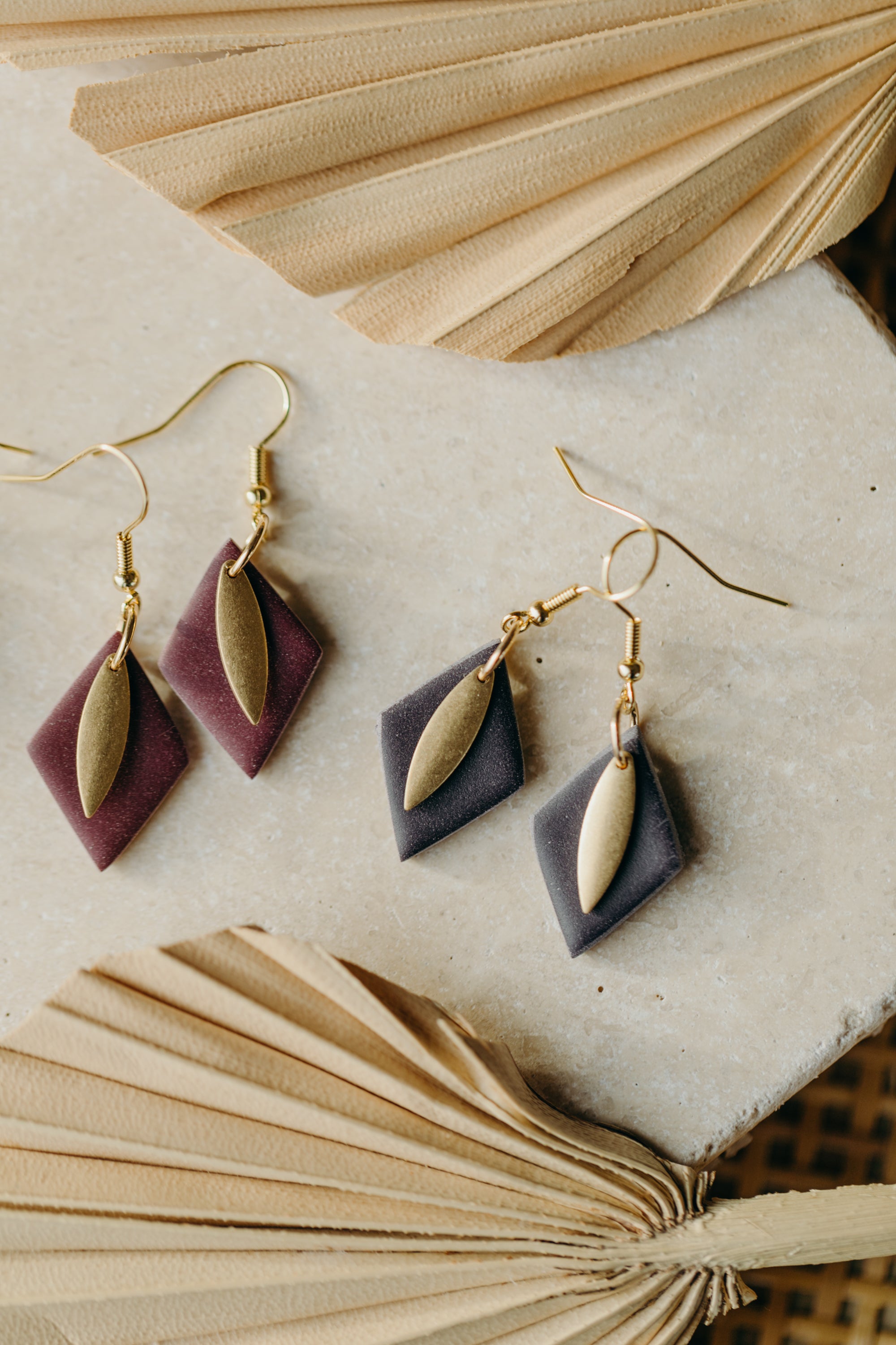 diamond-shaped polymer clay earrings in berry tones