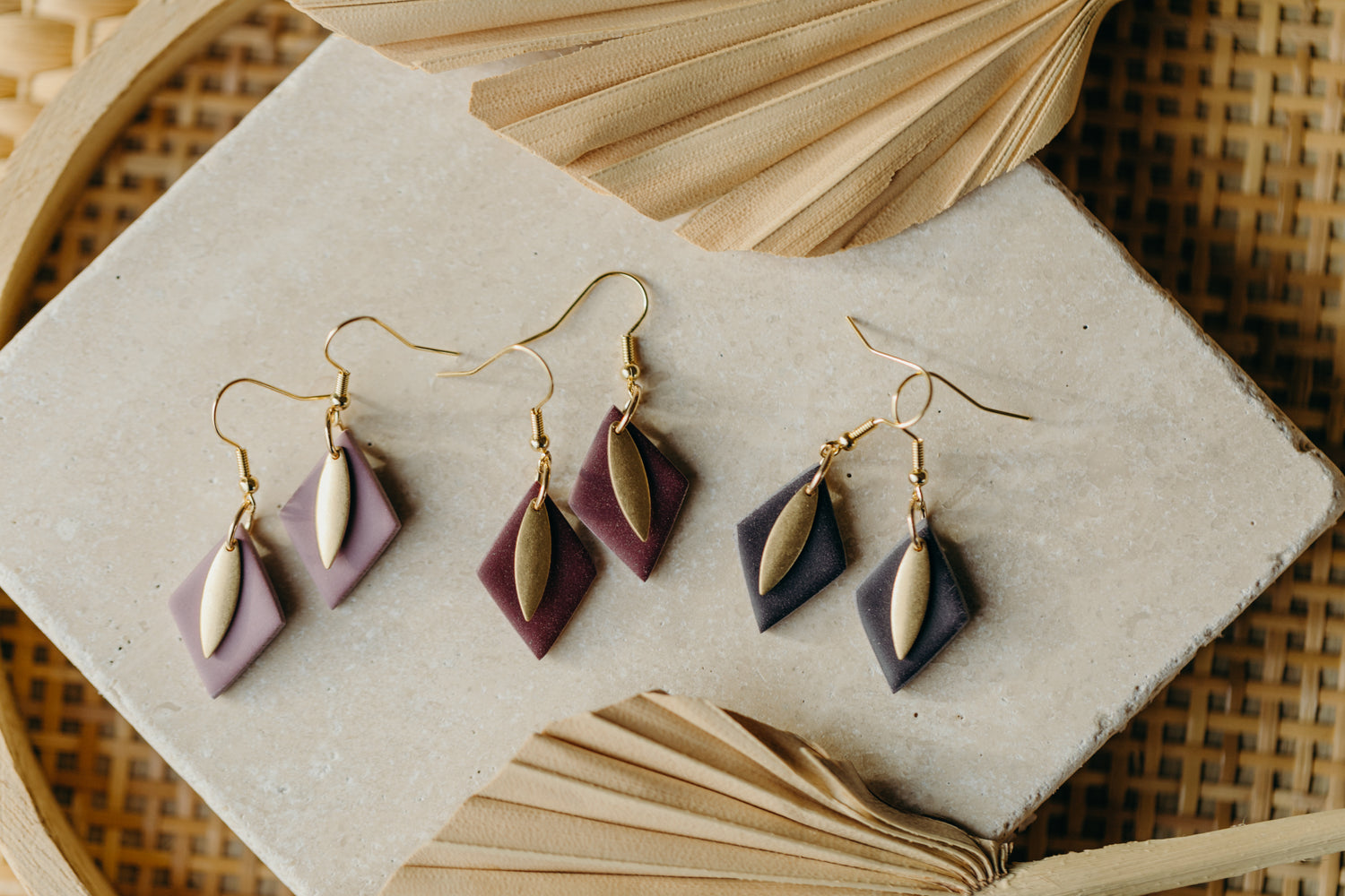 diamond-shaped polymer clay earrings in berry tones