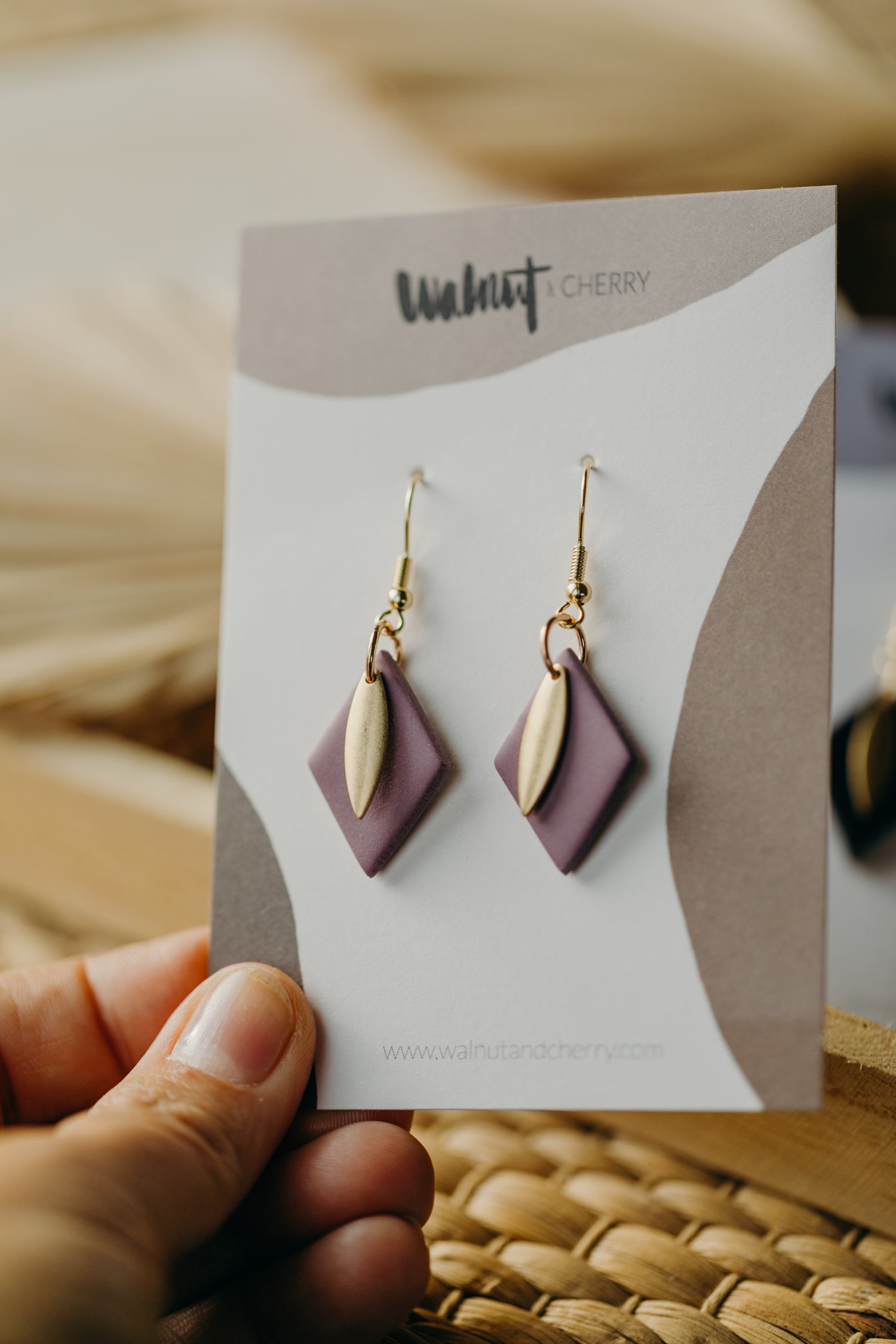 diamond-shaped polymer clay earrings in berry tones