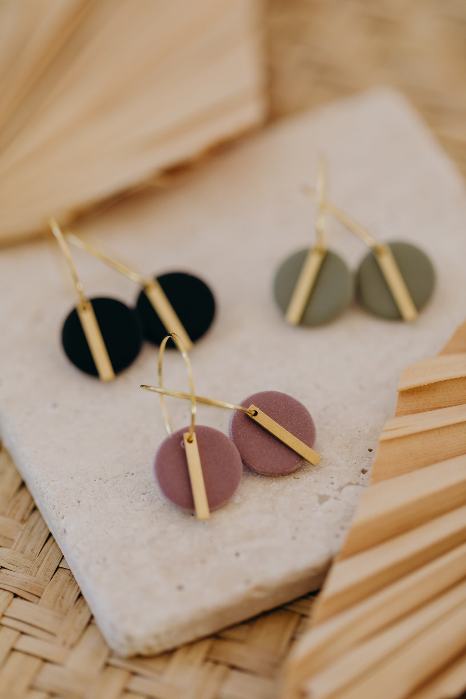 Hoop earrings with round polymer clay pendant and leaf