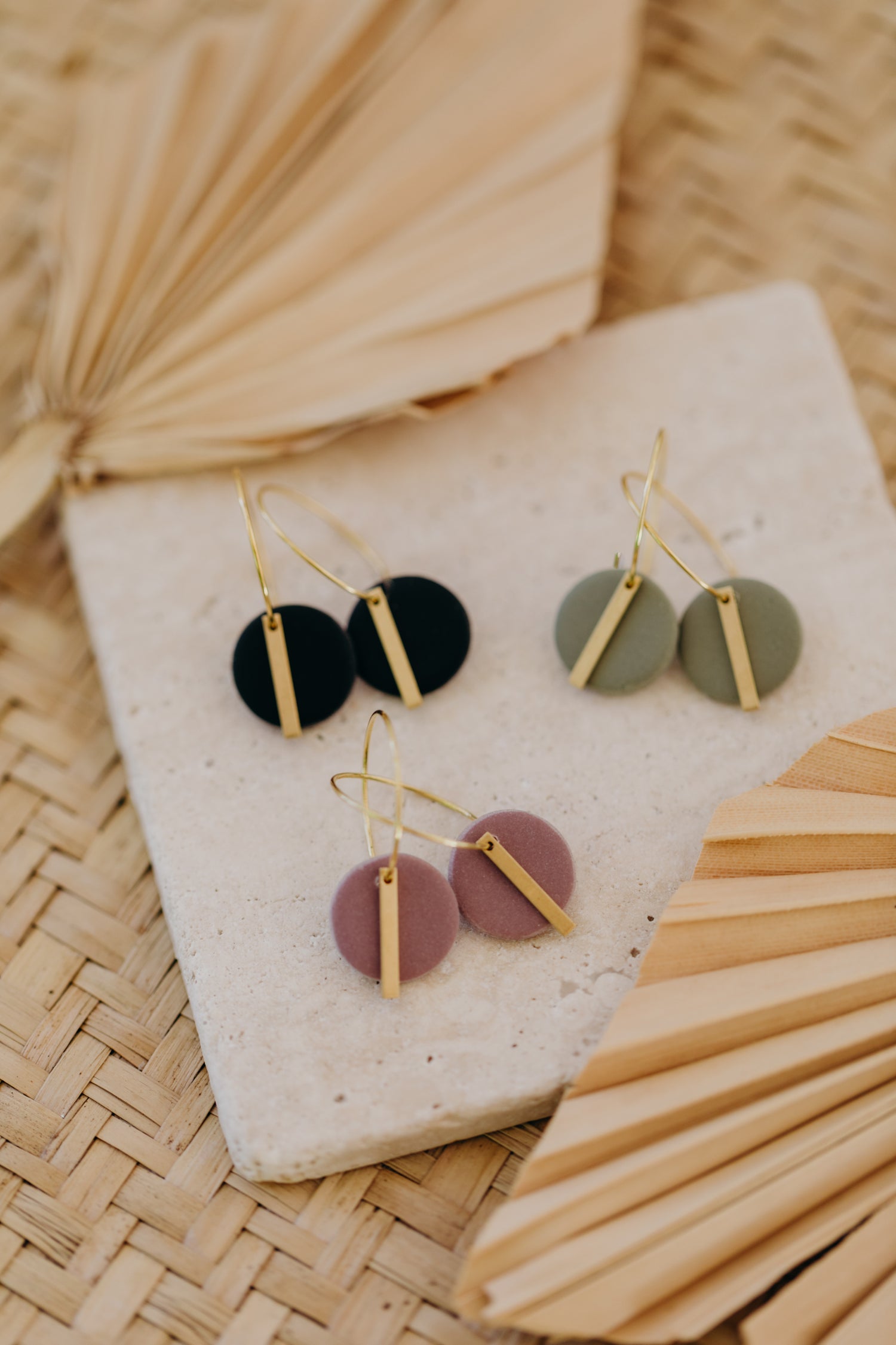 Hoop earrings with round polymer clay pendant and leaf