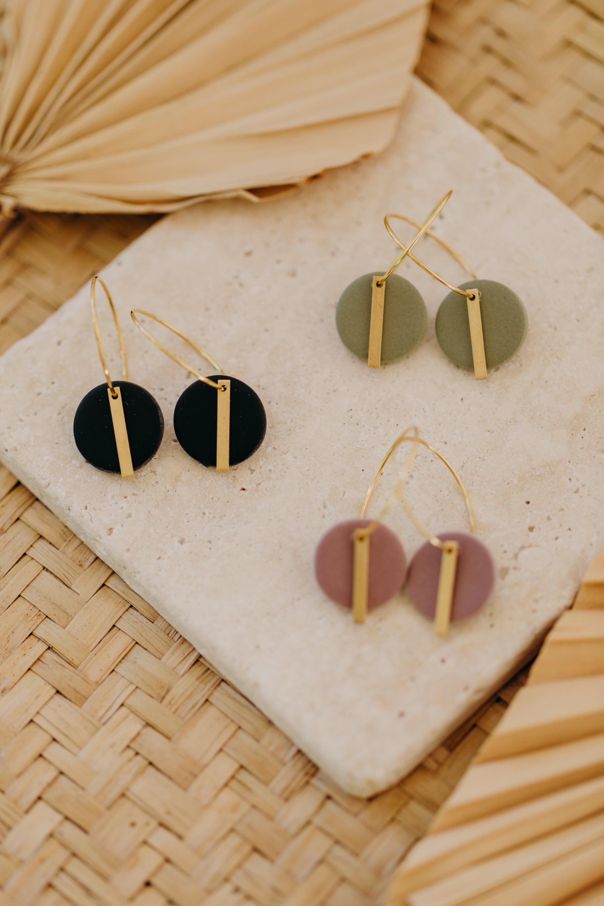 Hoop earrings with round polymer clay pendant and leaf