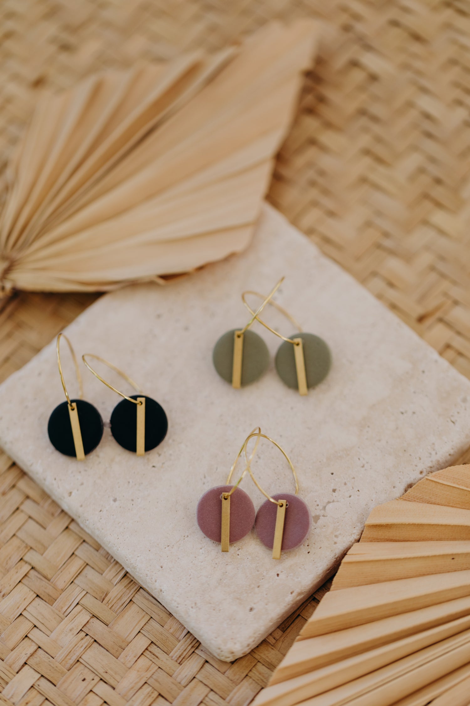 Hoop earrings with round polymer clay pendant and leaf