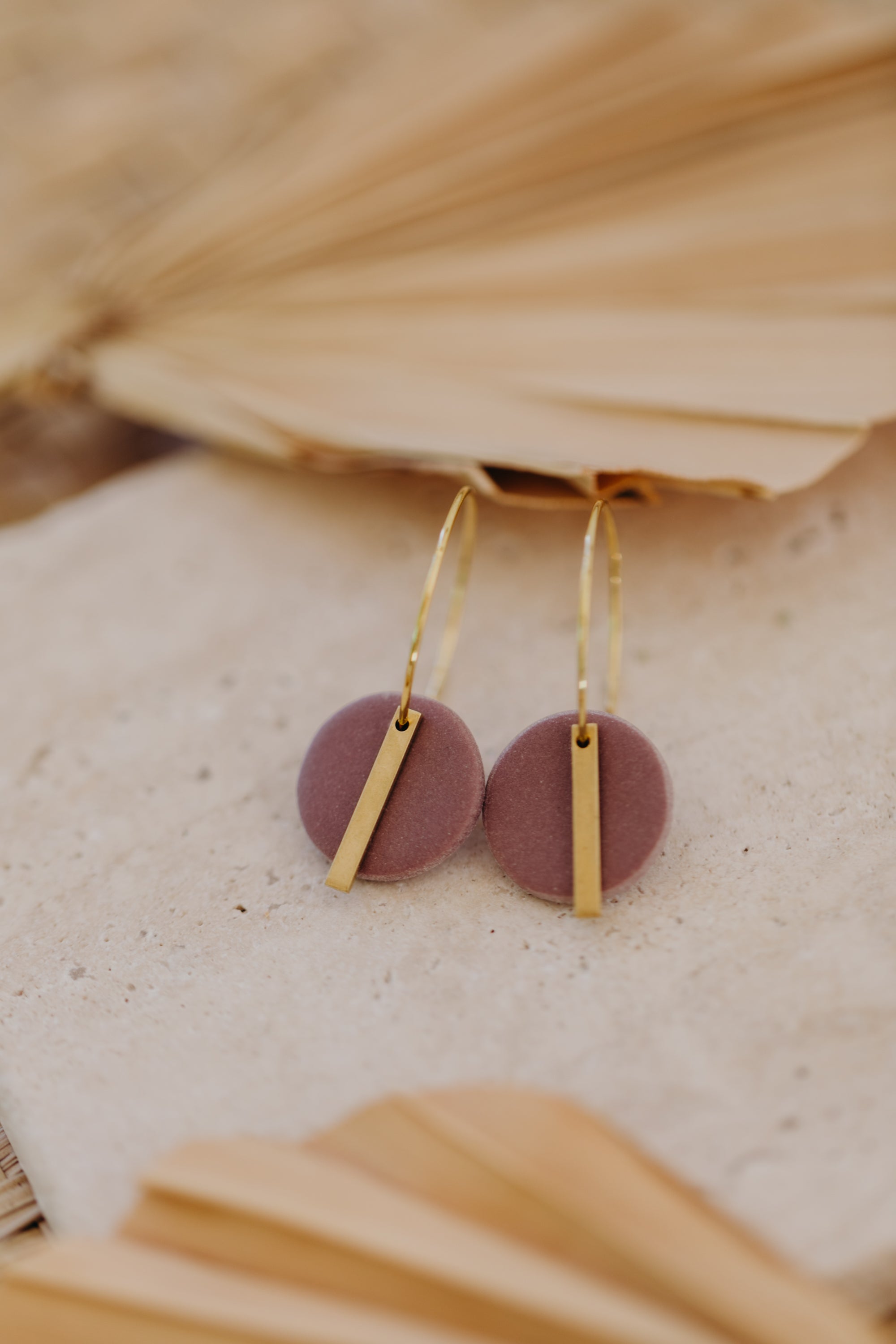 Hoop earrings with round polymer clay pendant and leaf