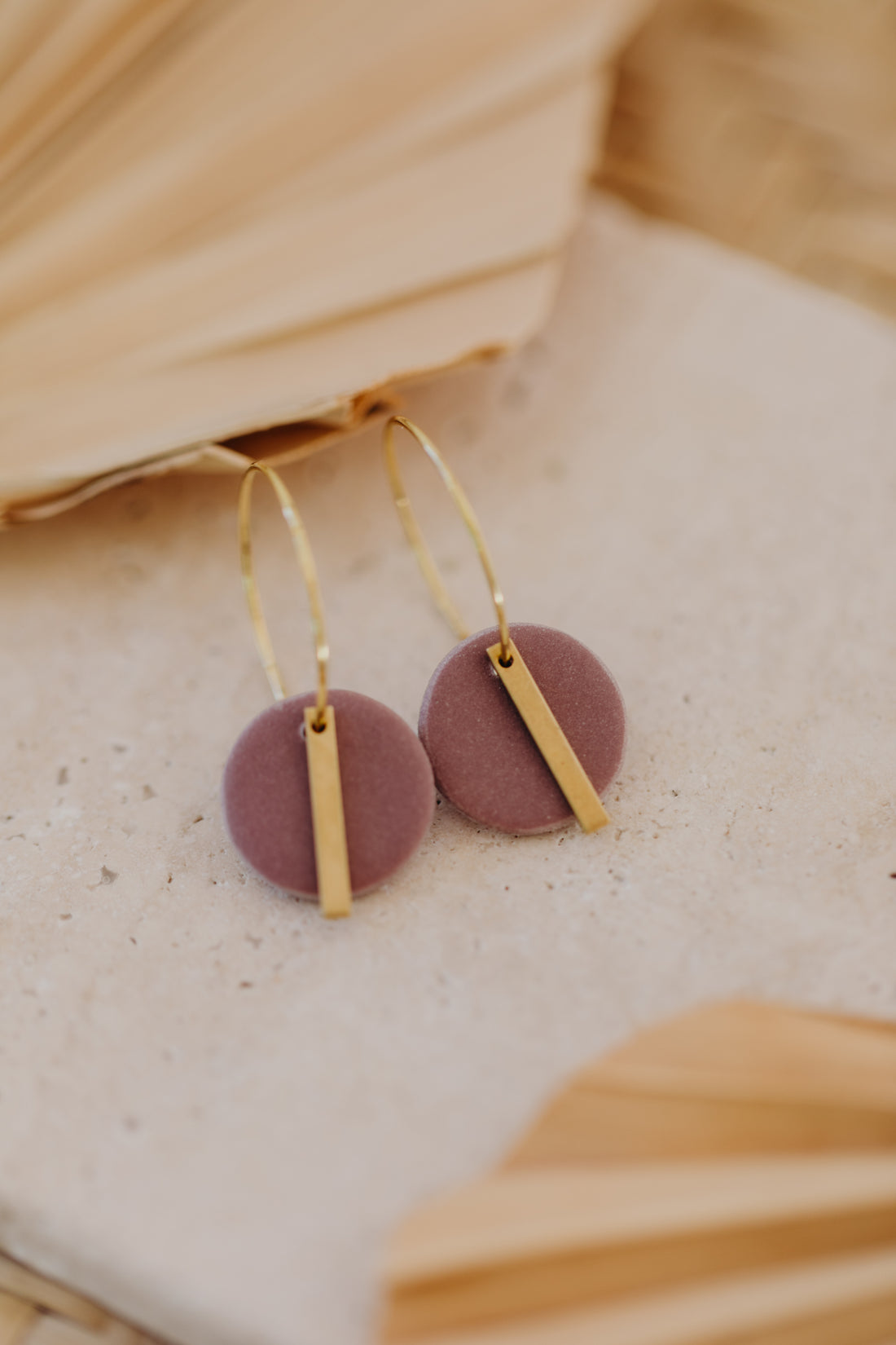 Hoop earrings with round polymer clay pendant and leaf