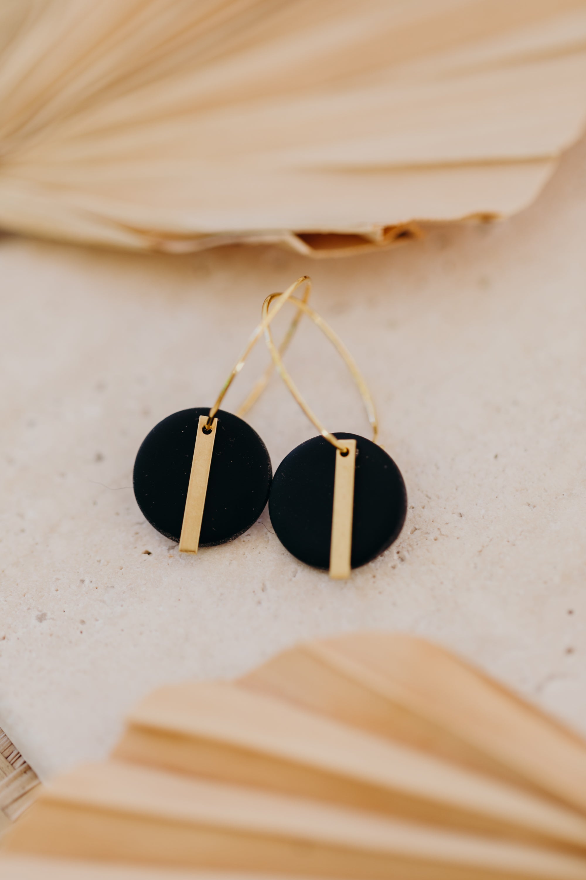 Hoop earrings with round polymer clay pendant and leaf