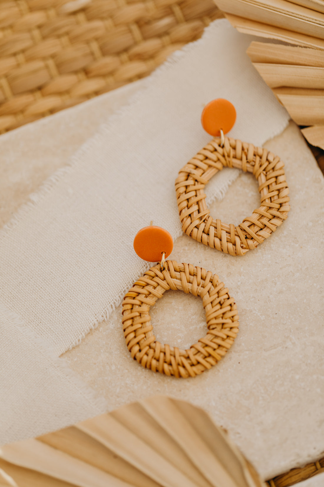 Polymer clay earrings in orange with rattan pendant hexagon