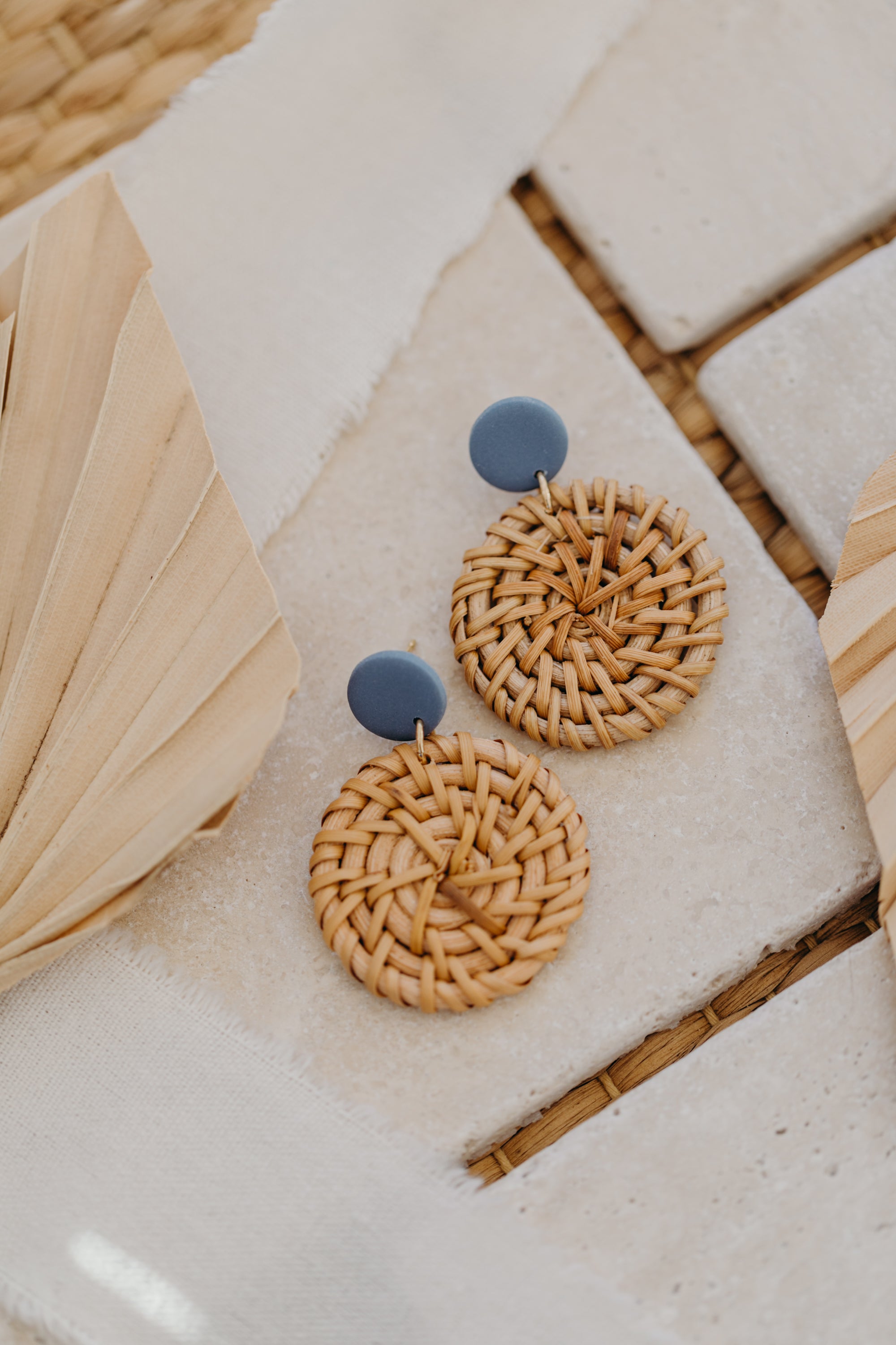 blue polymer clay earrings with round rattan pendant