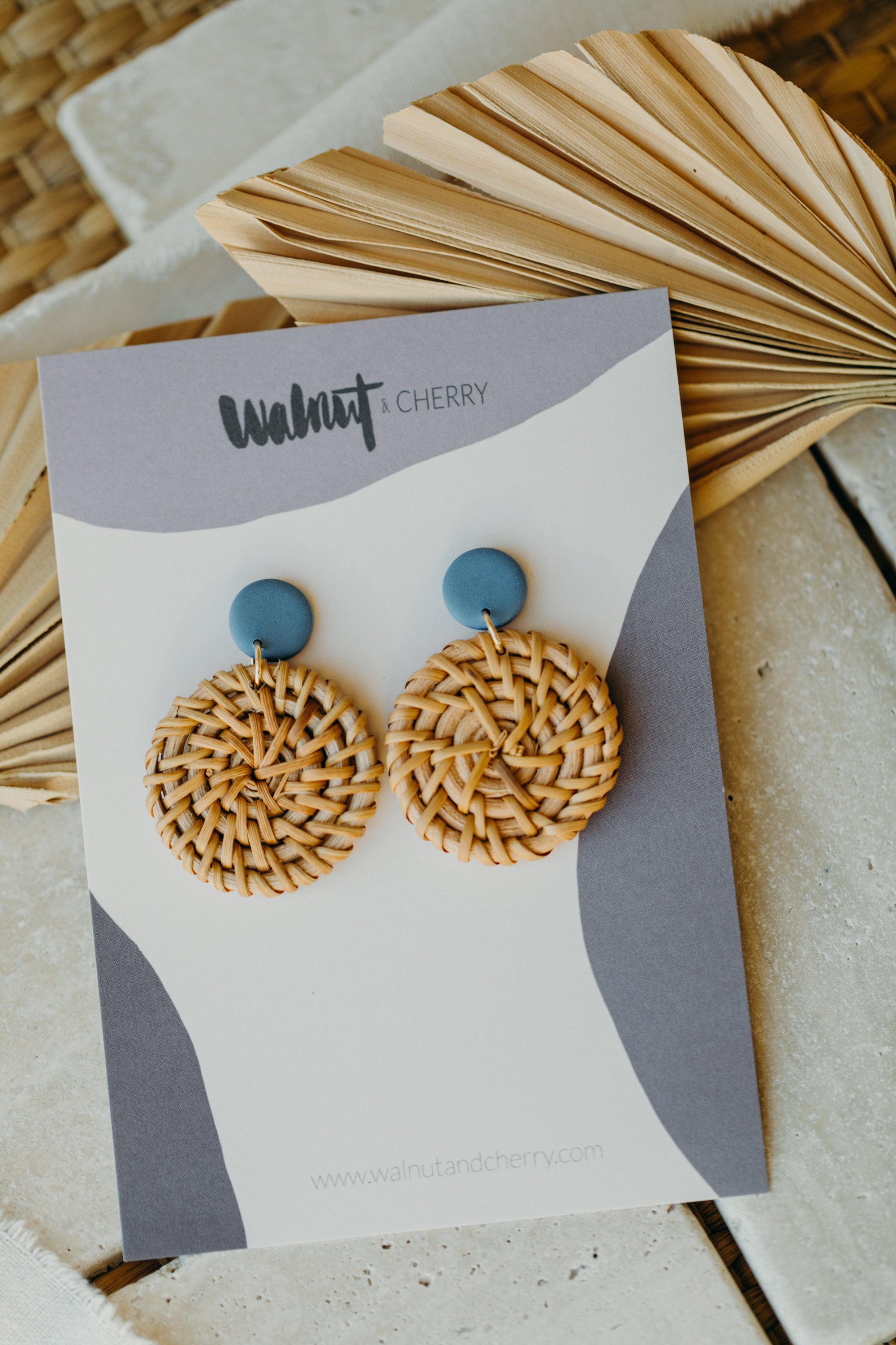 blue polymer clay earrings with round rattan pendant