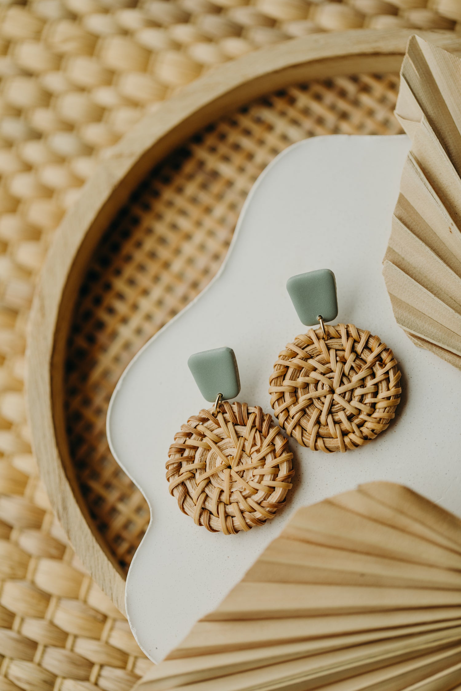 round polymer clay earrings in the color lime with round rattan pendant