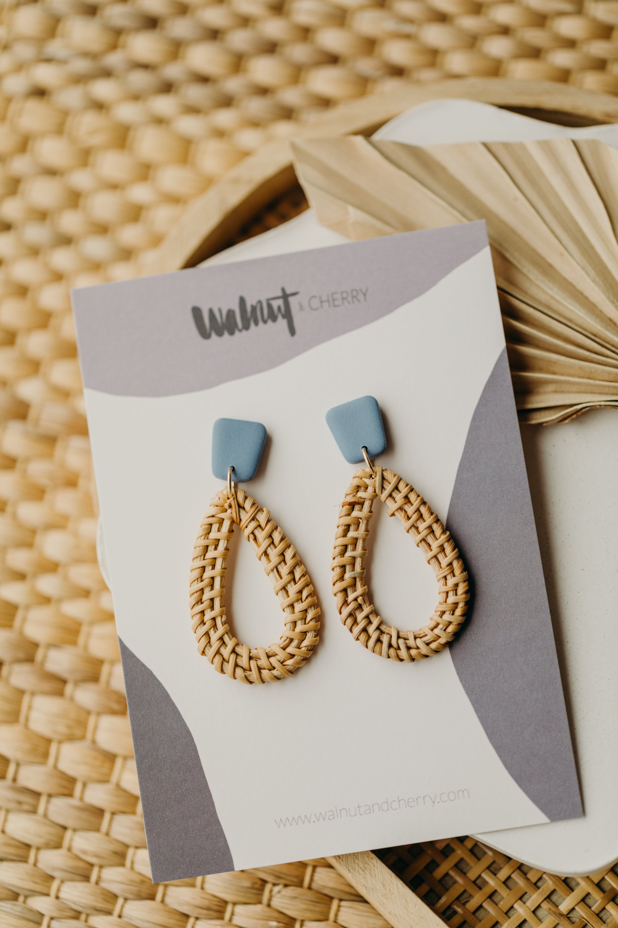 blue polymer clay earrings with rattan pendant drops