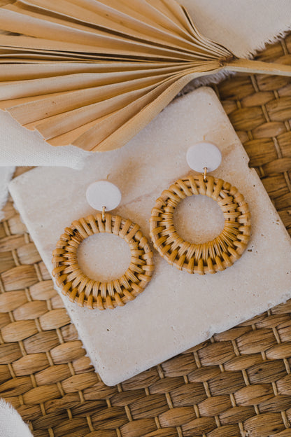 round polymer clay earrings in the color light pink with rattan pendant circle