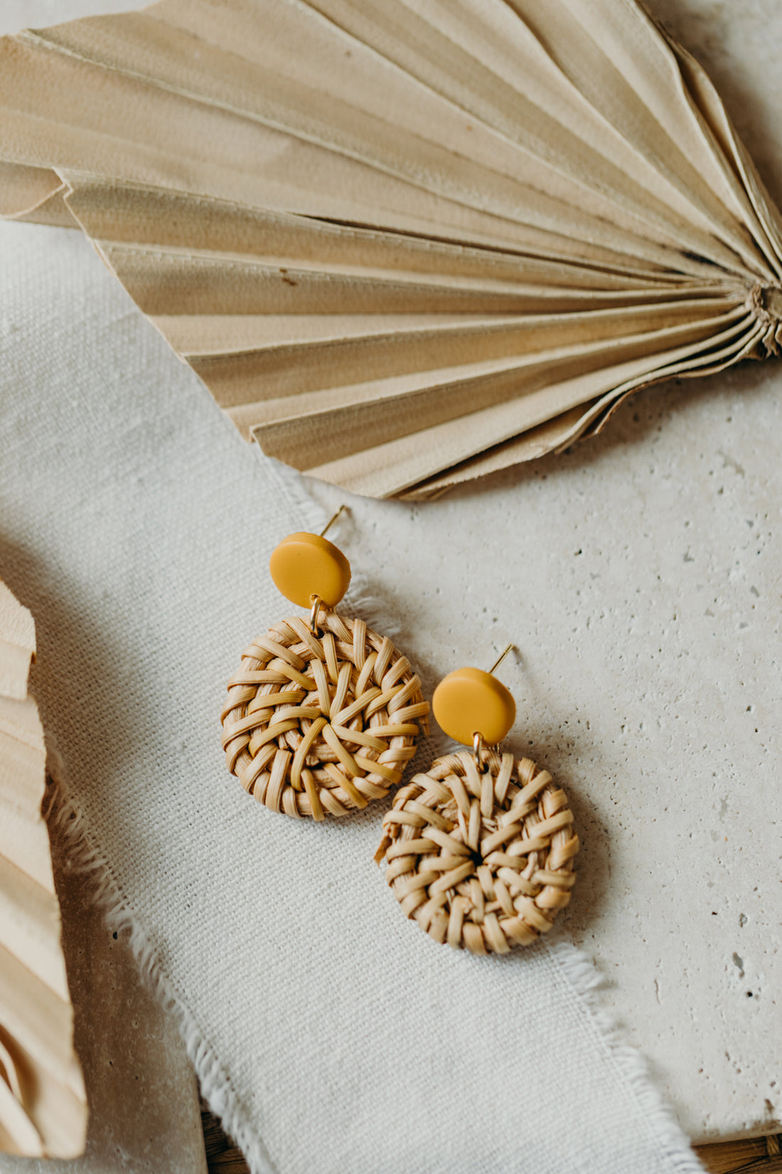 blue polymer clay earrings with round rattan pendant