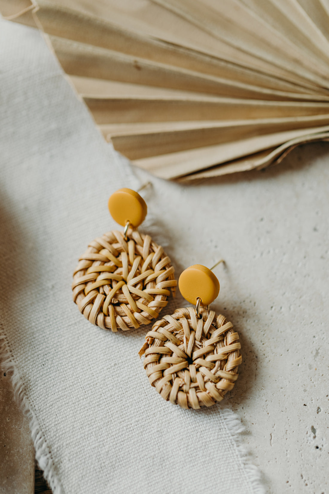 blue polymer clay earrings with round rattan pendant