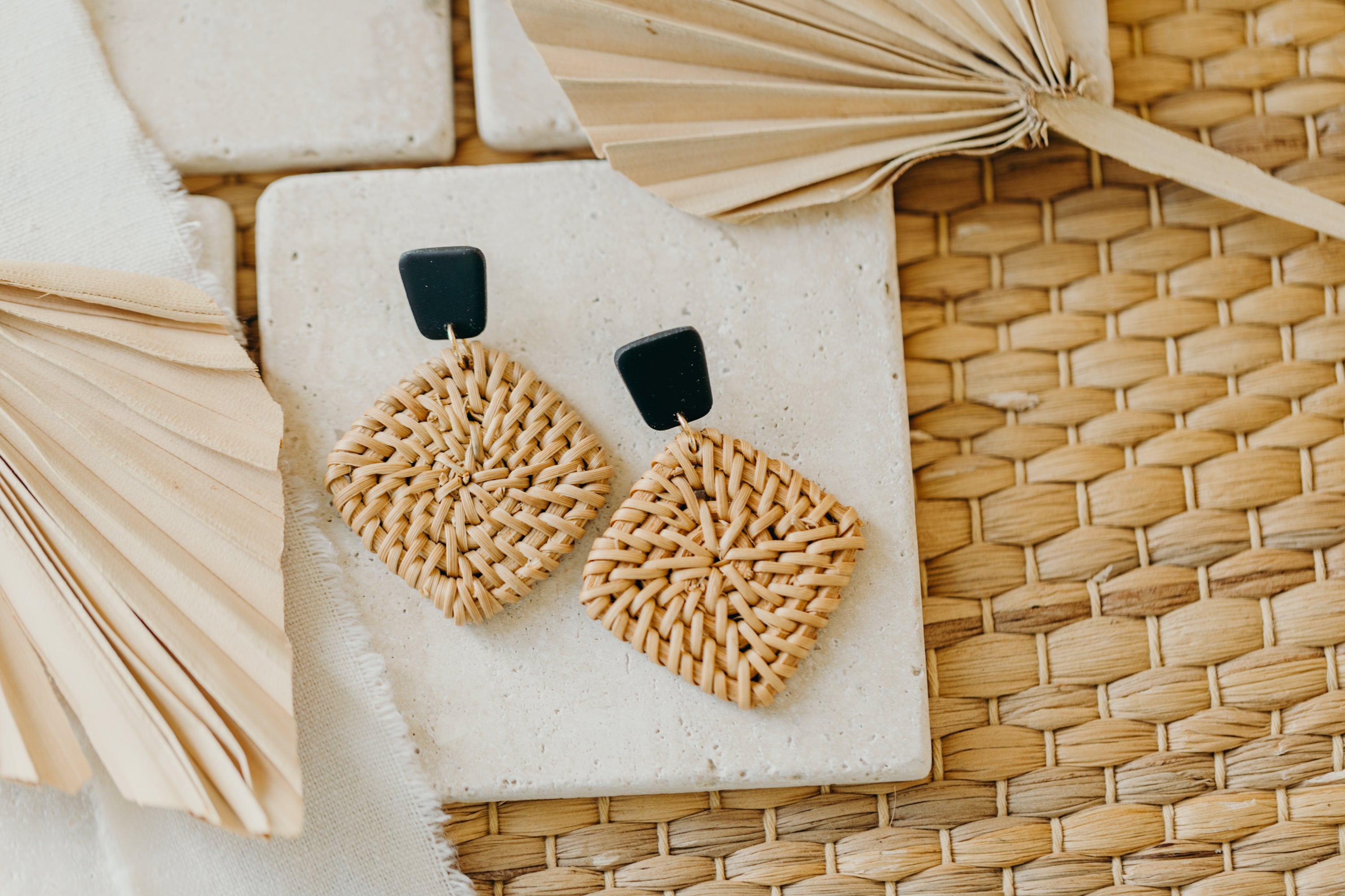 square polymer clay earrings in black with rattan pendant square