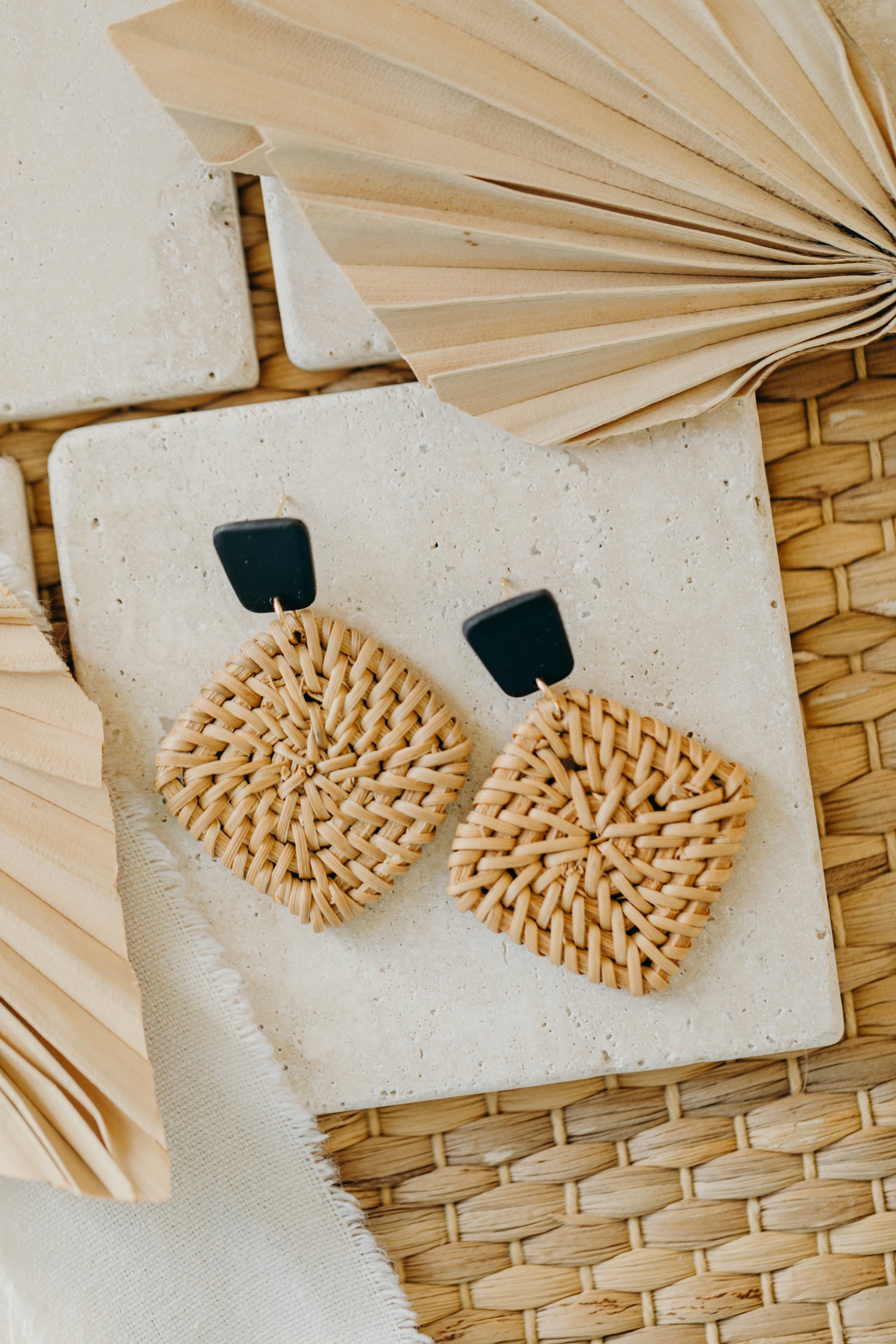 square polymer clay earrings in black with rattan pendant square