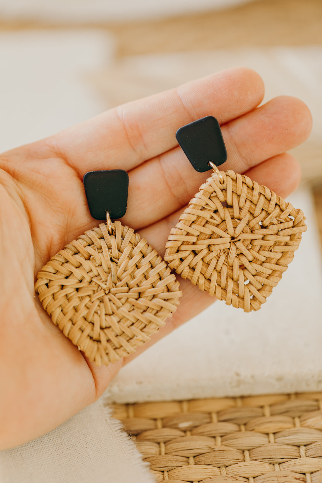 square polymer clay earrings in black with rattan pendant square