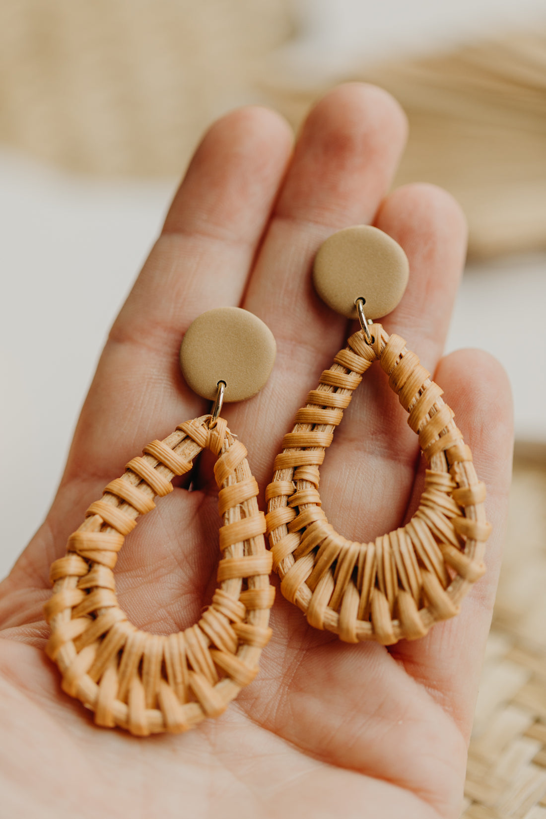 dark blue polymer clay earrings with rattan pendant drops