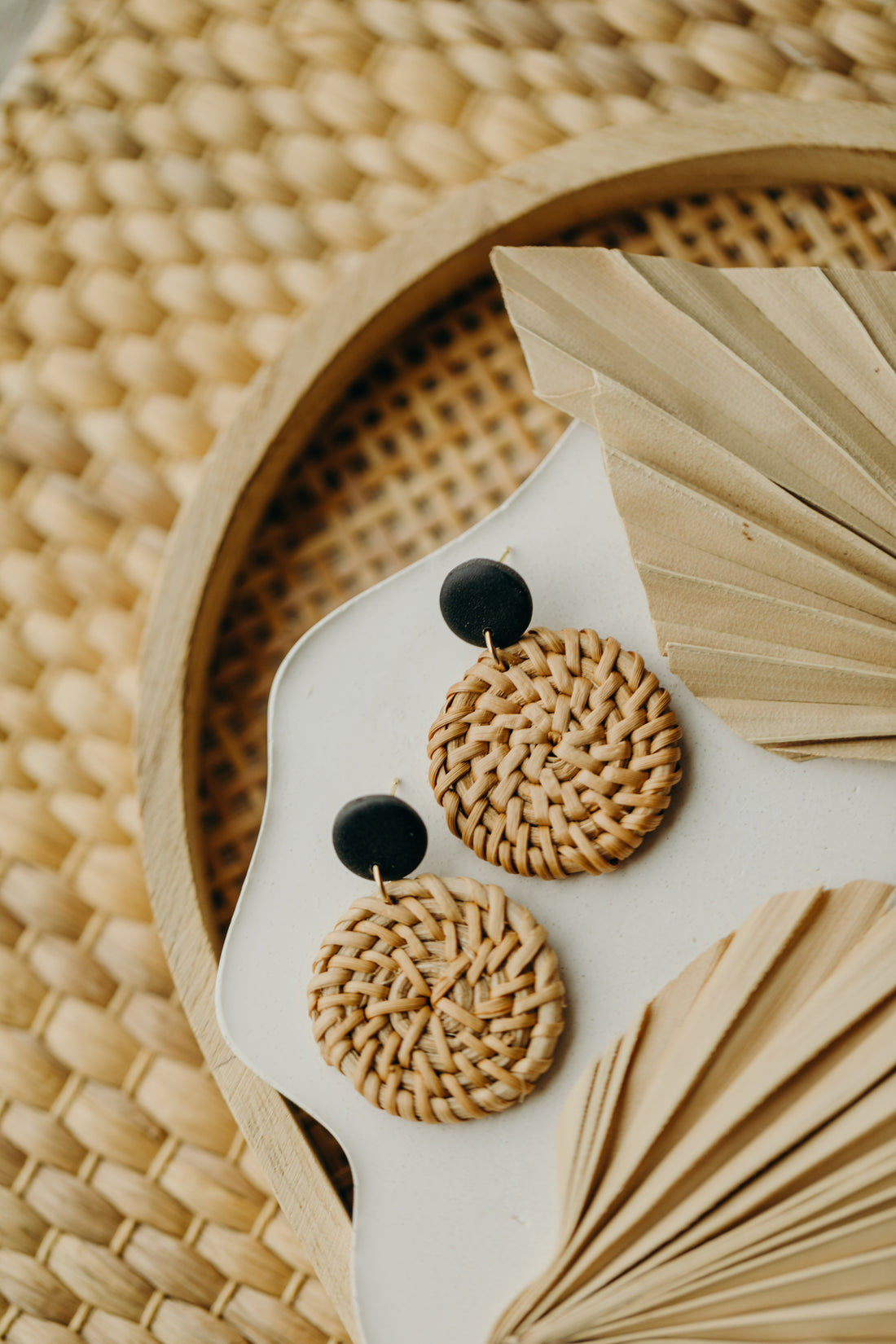 round polymer clay earrings in black with round rattan pendant