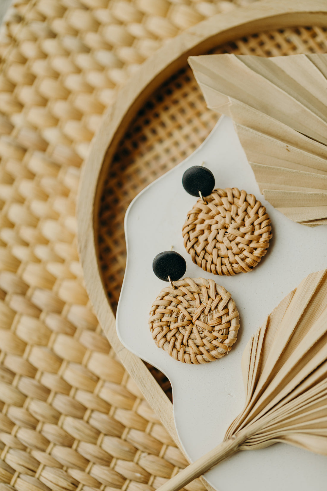 round polymer clay earrings in black with round rattan pendant