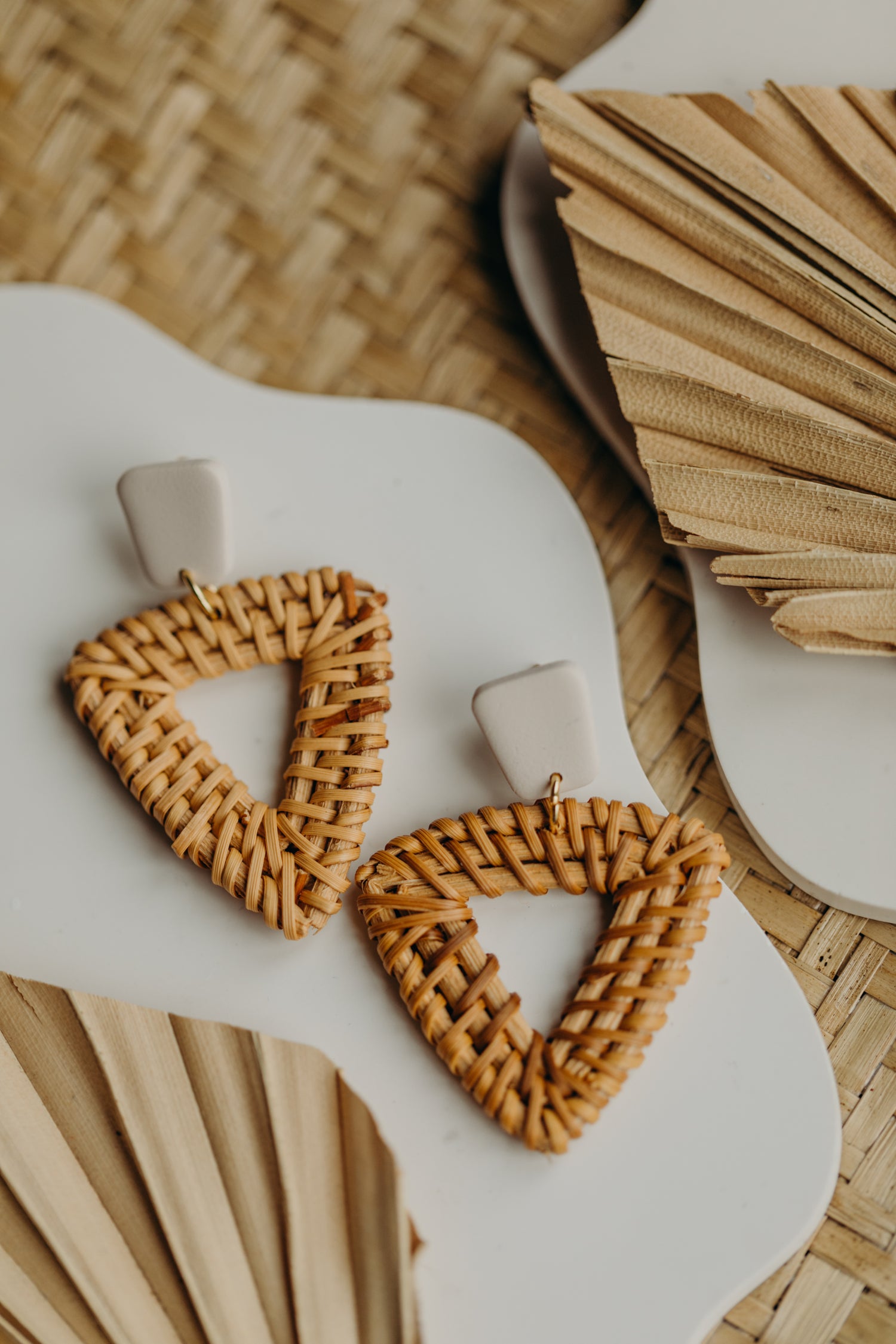 triangular polymer clay earrings in the color Barolo with rattan pendant triangle