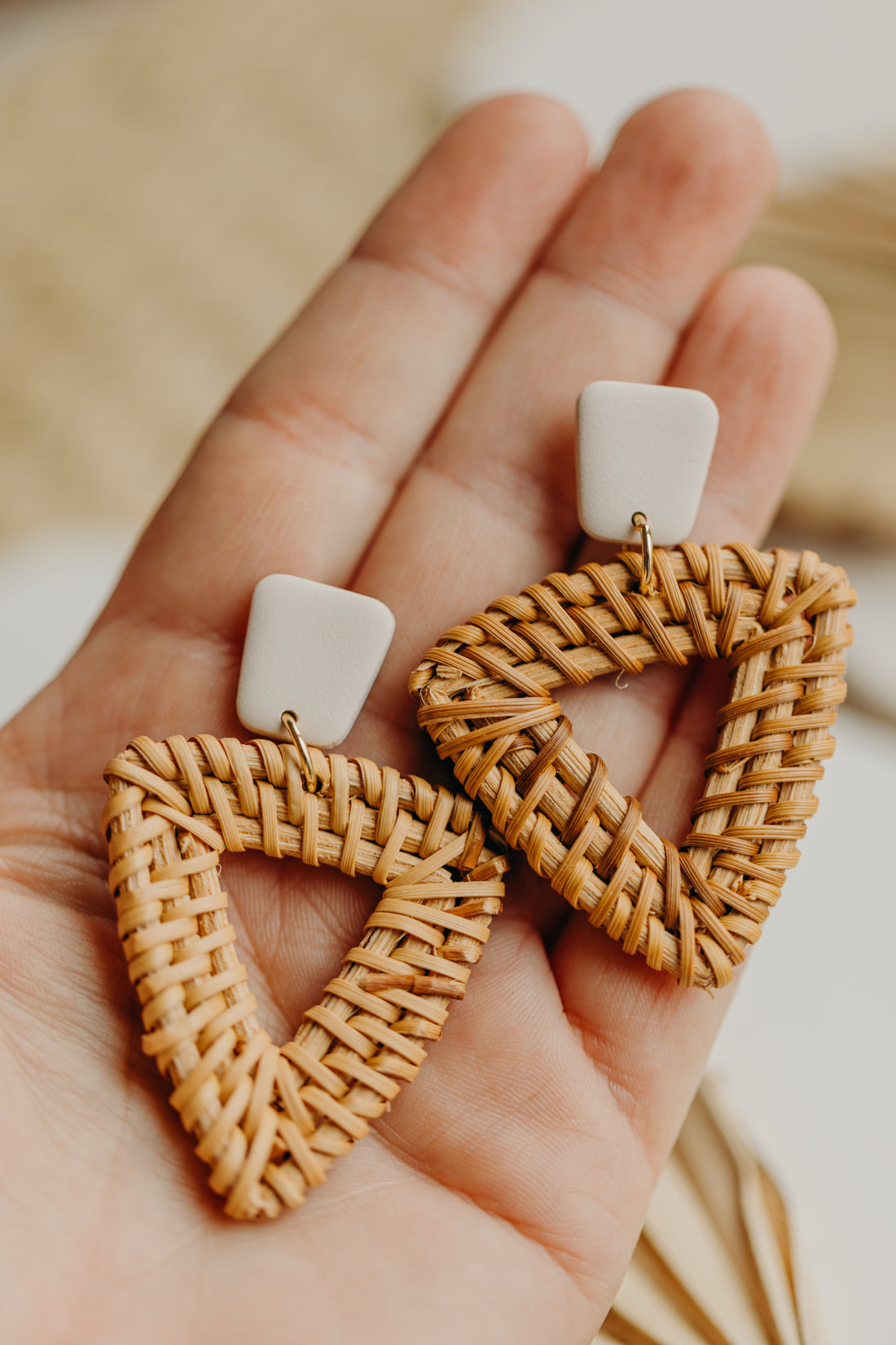 triangular polymer clay earrings in the color Barolo with rattan pendant triangle