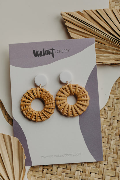 round polymer clay earrings in brown with rattan pendant circle