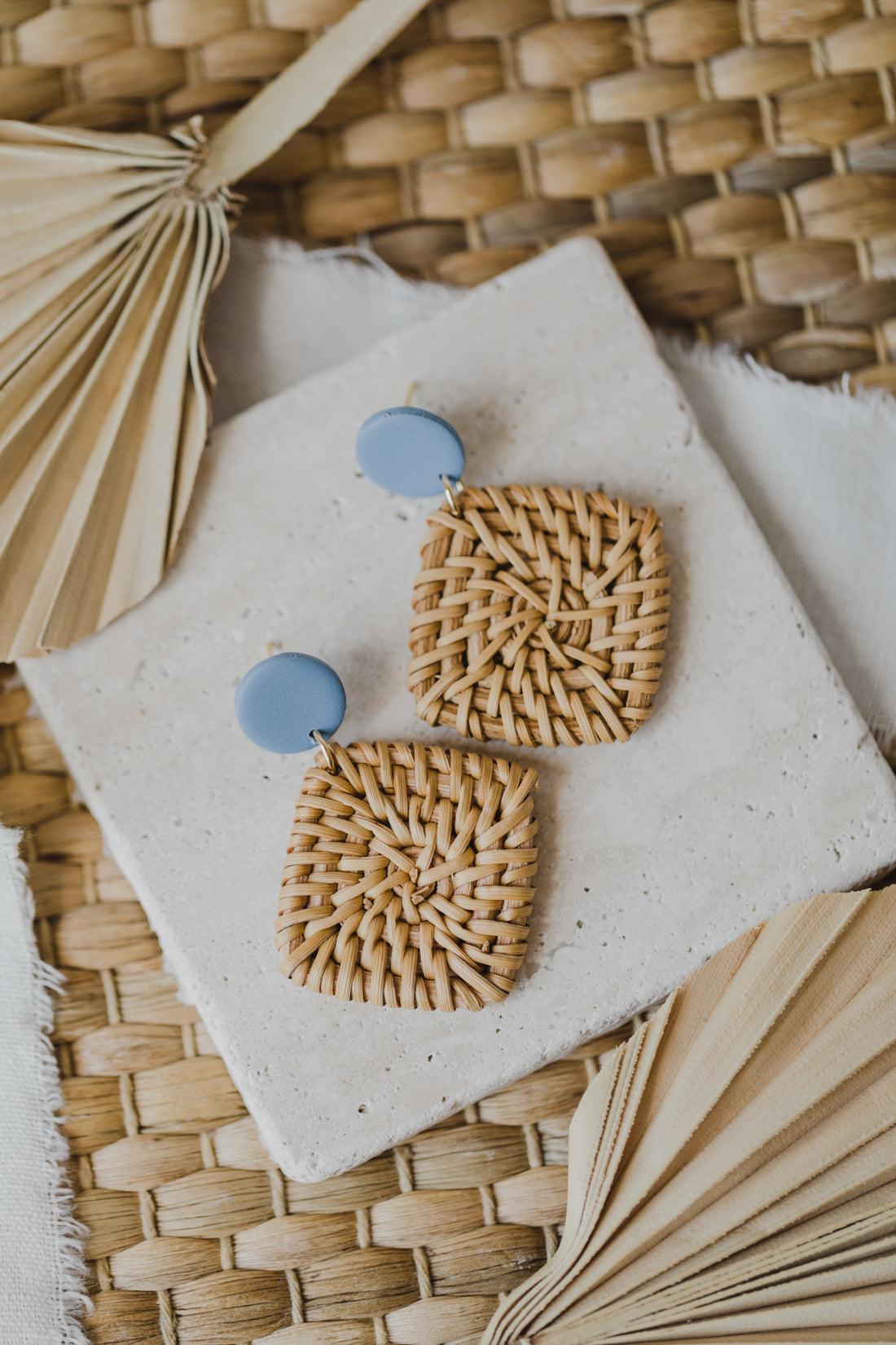 round polymer clay earrings in blue with rattan pendant square