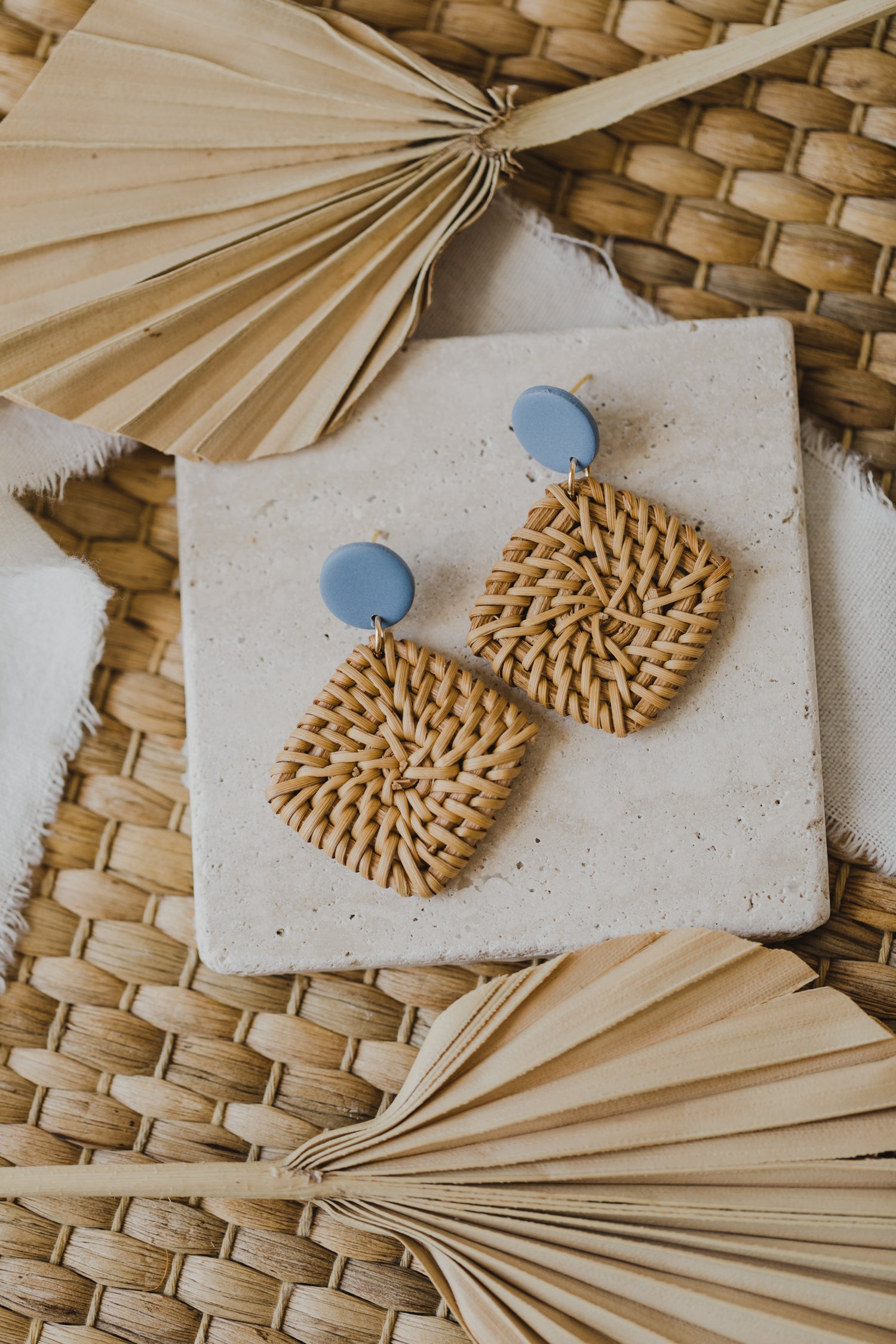 round polymer clay earrings in blue with rattan pendant square