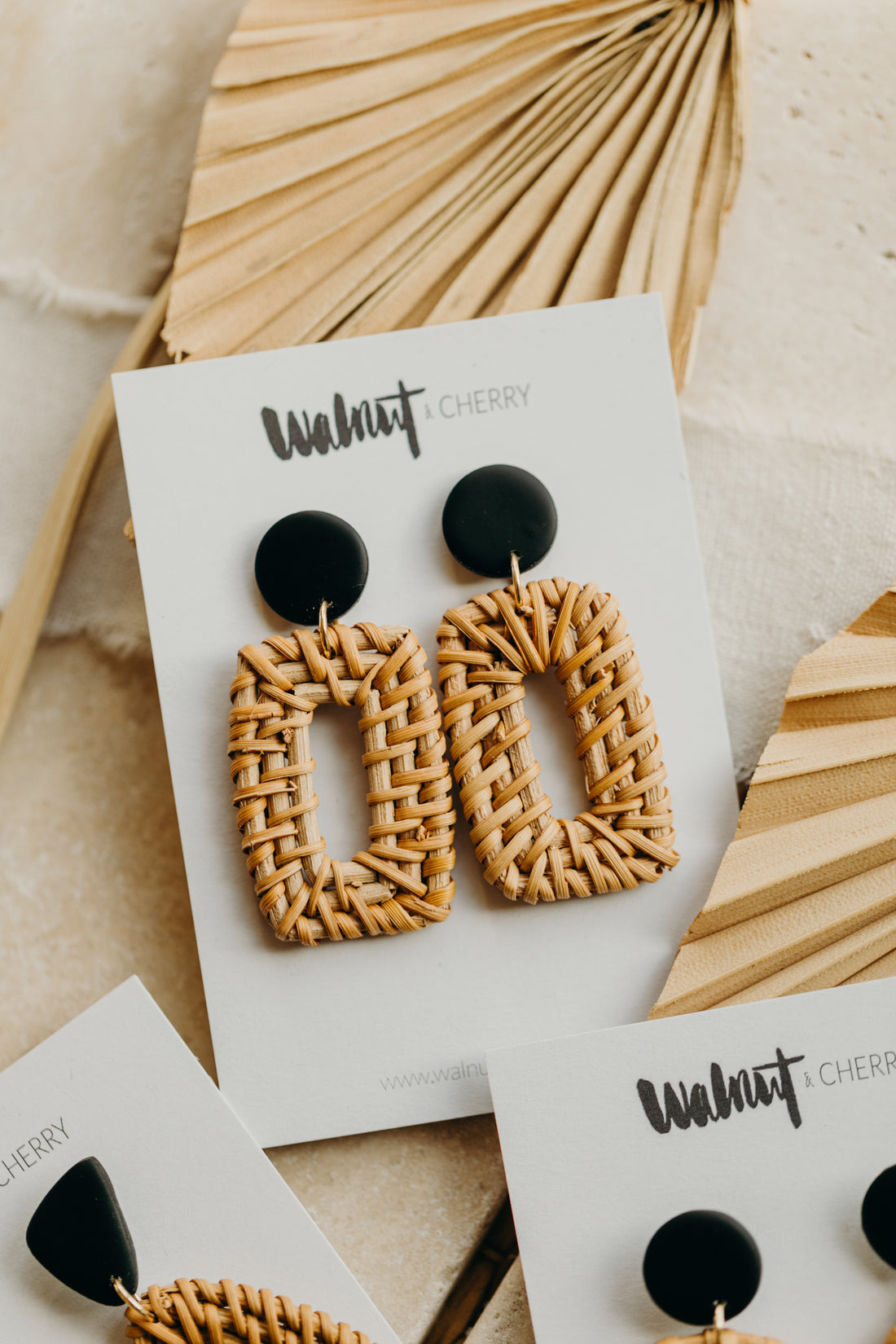 black polymer clay earrings with rattan pendant rectangle